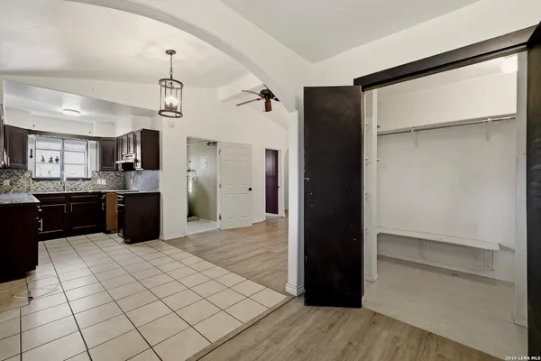 a kitchen with a refrigerator and a sink