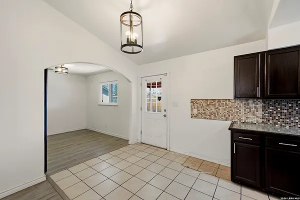 a kitchen with stainless steel appliances a refrigerator and a stove top oven