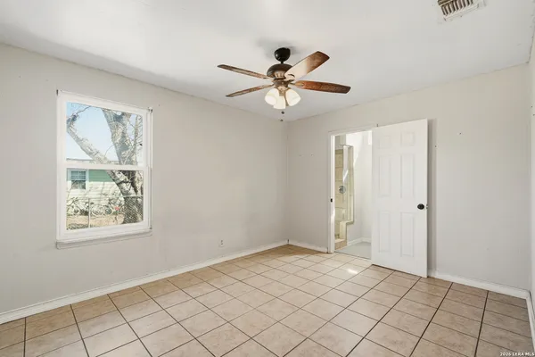 a view of an empty room and window