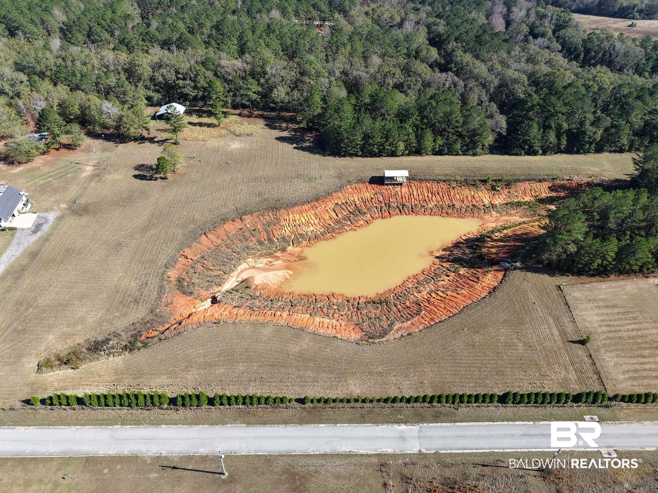 0 Stokley Court Atmore, AL 36502 - Photo 5 of 22 Aerial view of property and surrounding area with a forest