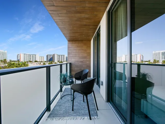 a balcony view with a couple of chairs