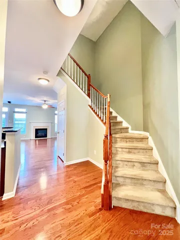 a view of a hallway with wooden shelves