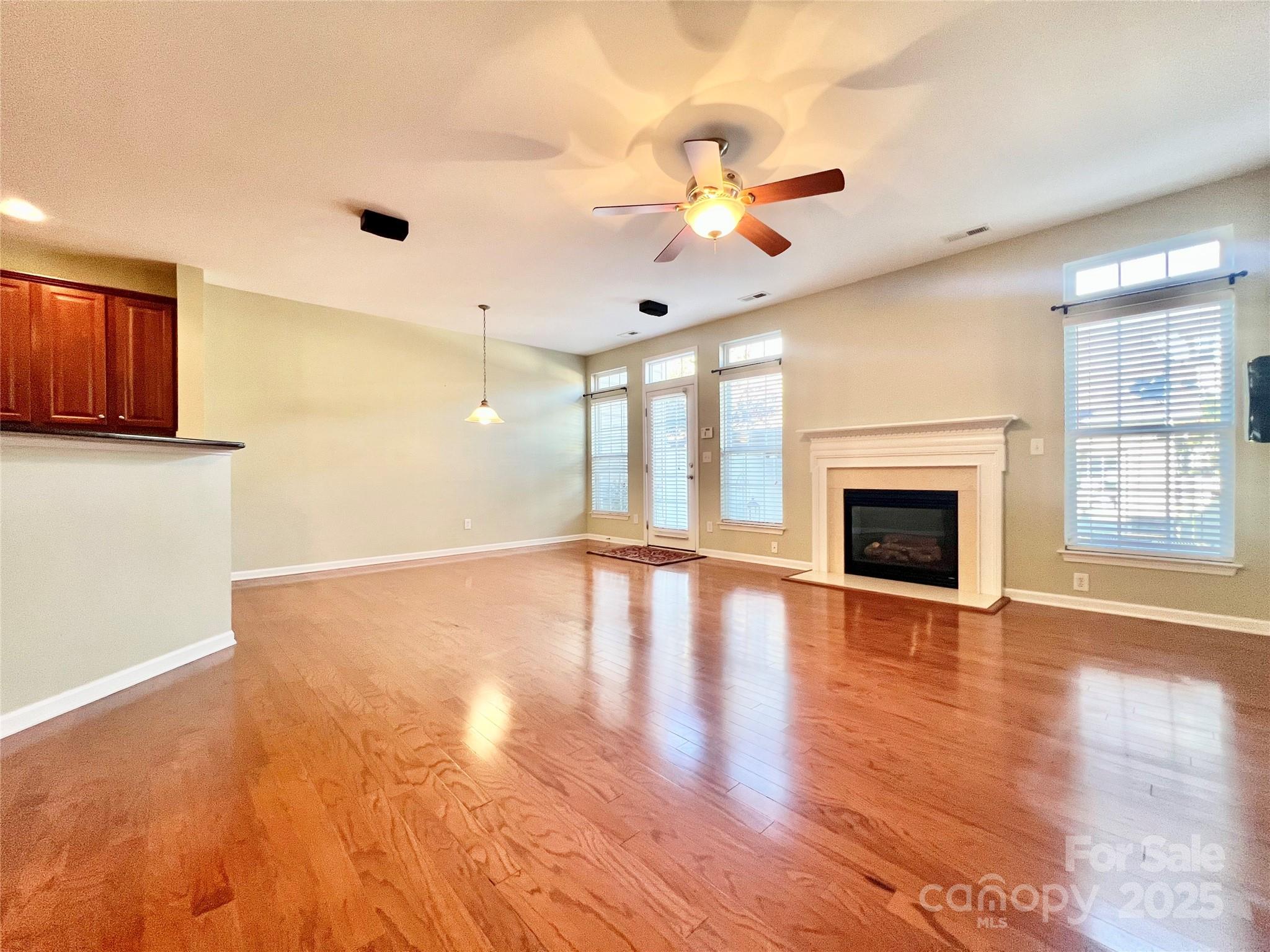 8326 Viewpoint Lane, Unit 802 Cornelius, NC 28031 - Photo 18 of 43 a view of an empty room with window and wooden floor
