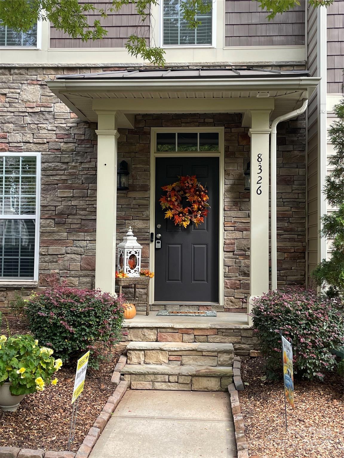 8326 Viewpoint Lane, Unit 802 Cornelius, NC 28031 - Photo 2 of 43 a front view of a house with plants