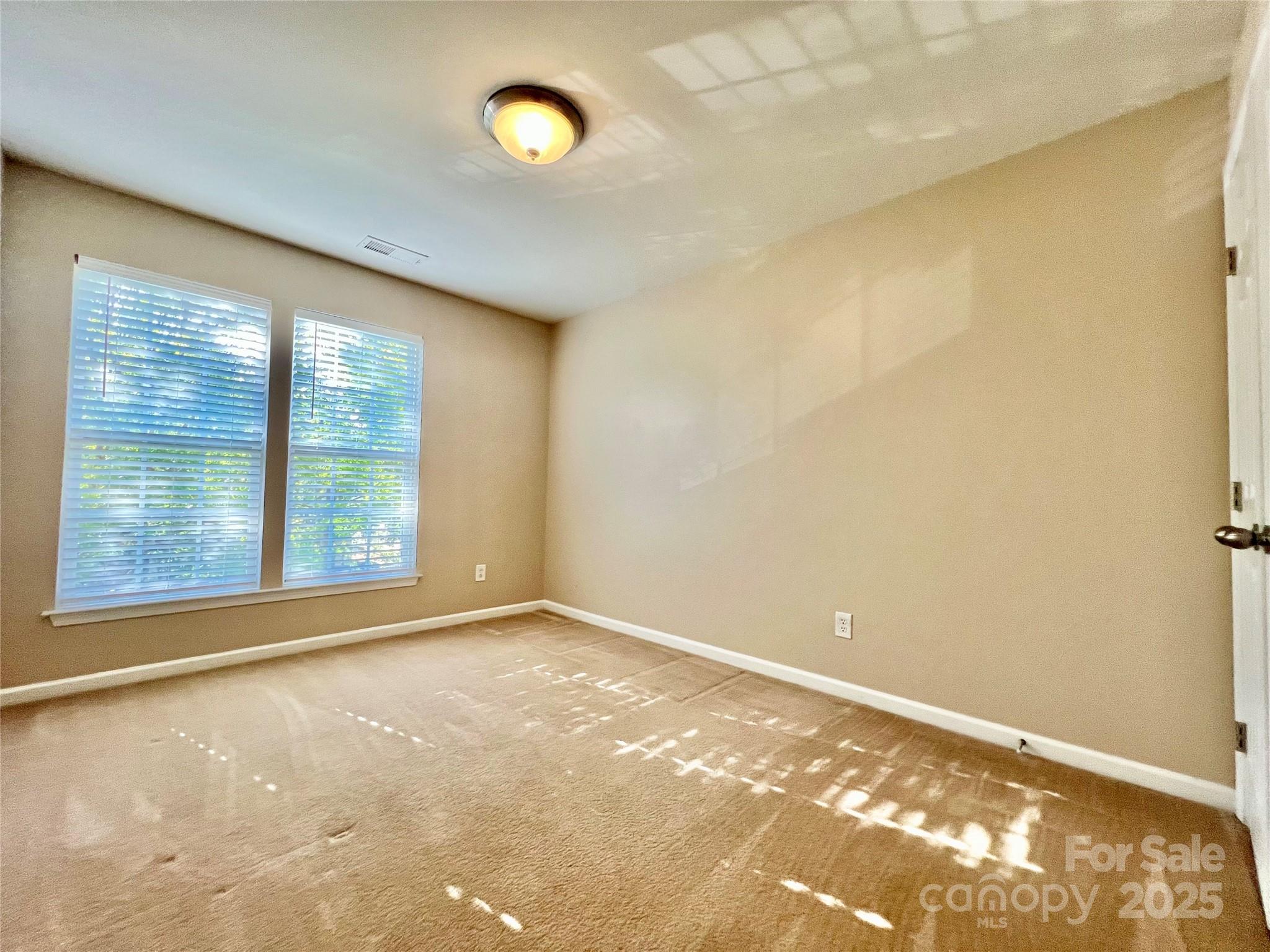 8326 Viewpoint Lane, Unit 802 Cornelius, NC 28031 - Photo 30 of 43 a view of an empty room with a window