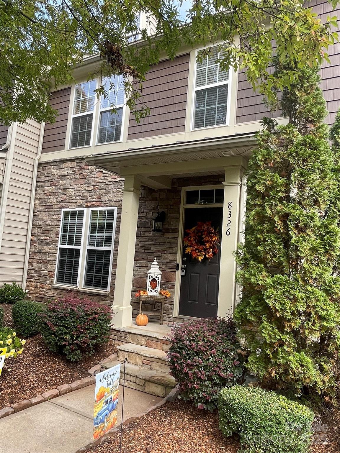 8326 Viewpoint Lane, Unit 802 Cornelius, NC 28031 - Photo 4 of 43 front view of a house with a yard