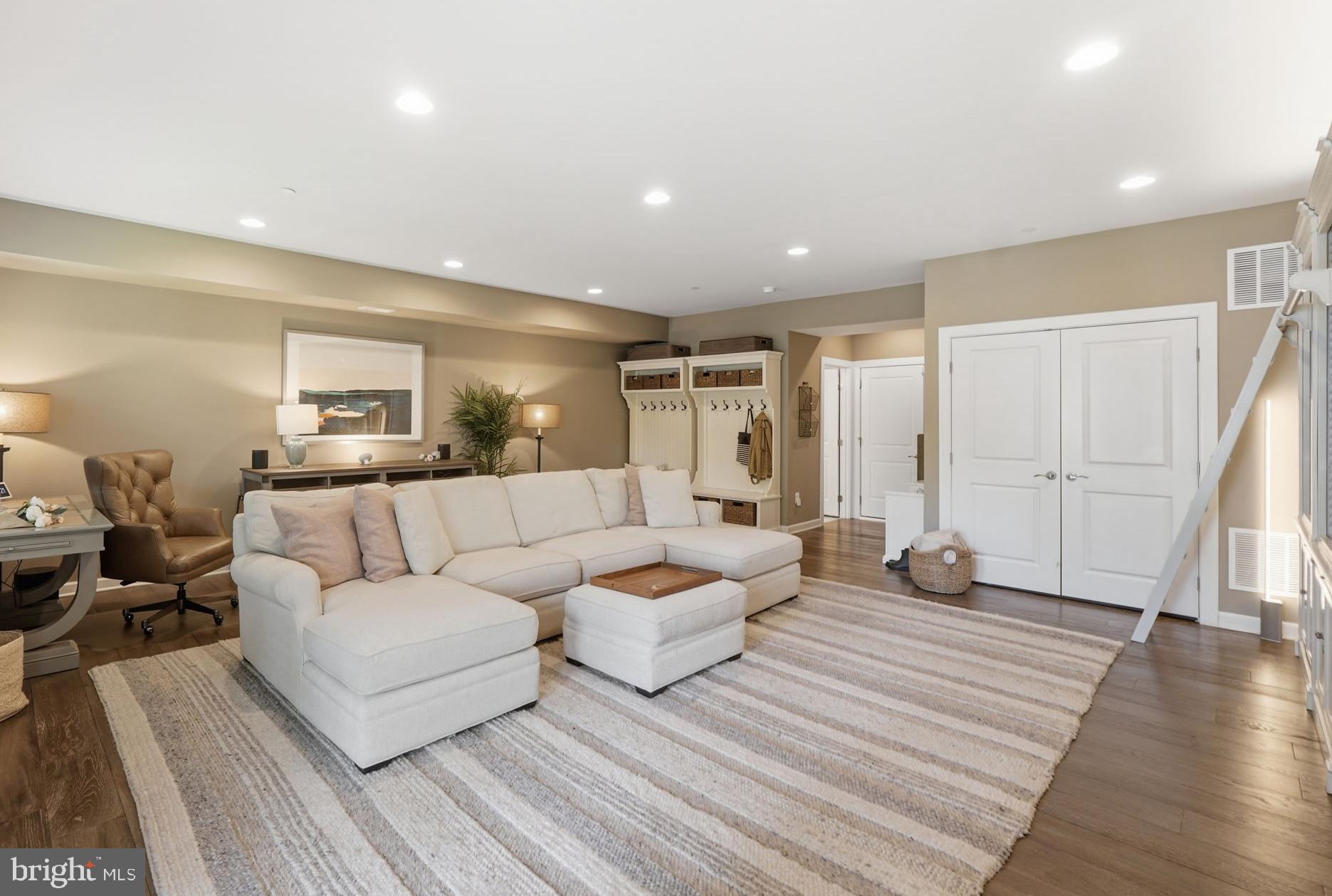 17812 Thomas Village Lane Sandy Spring, MD 20860 - Photo 31 of 37 a living room with furniture and a wooden floor