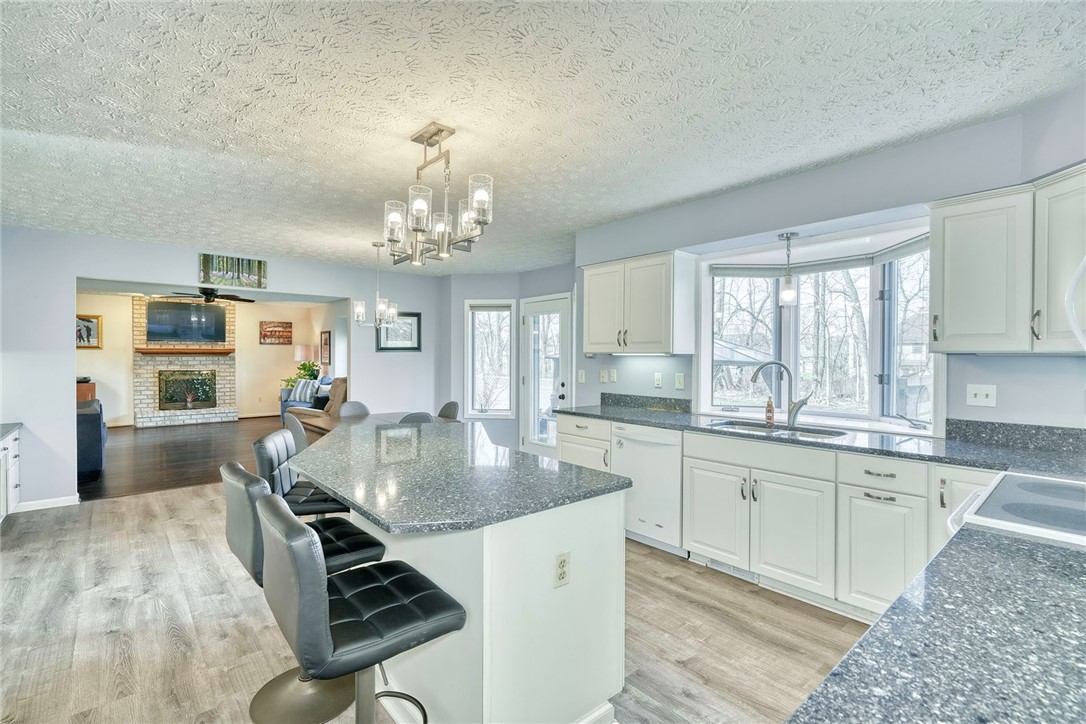 27 Edenfield Road Penfield, NY 14526 - Photo 12 of 48 updated eat-in kitchen with White cabinetry, grani