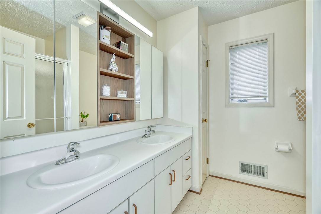 27 Edenfield Road Penfield, NY 14526 - Photo 23 of 48 Primary Bath with double sink vanity, tiled floor
