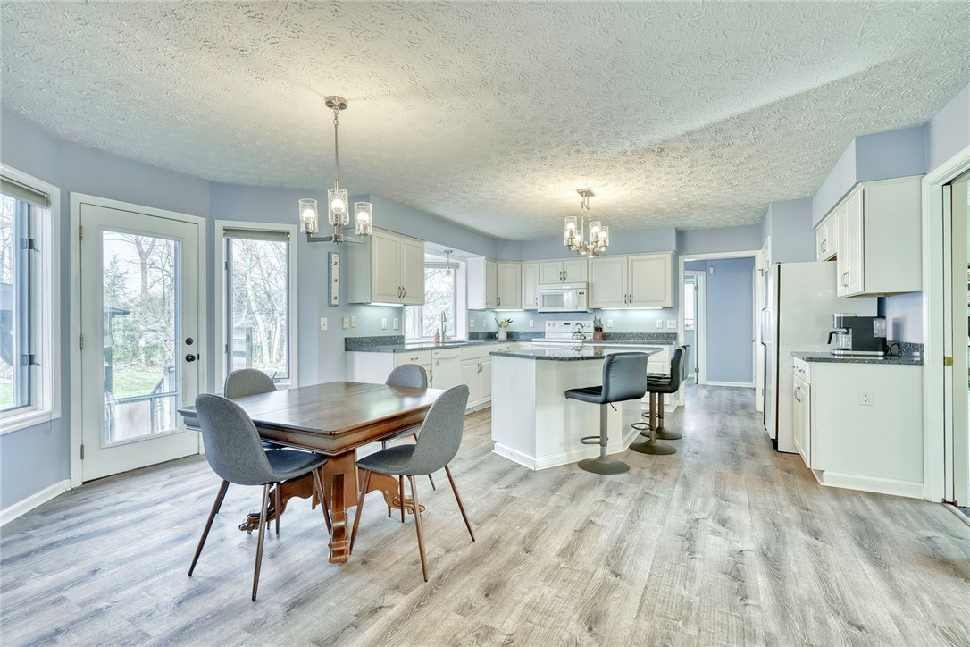 27 Edenfield Road Penfield, NY 14526 - Photo 8 of 48 Family rom opens to the kitchen! White cabinetry,