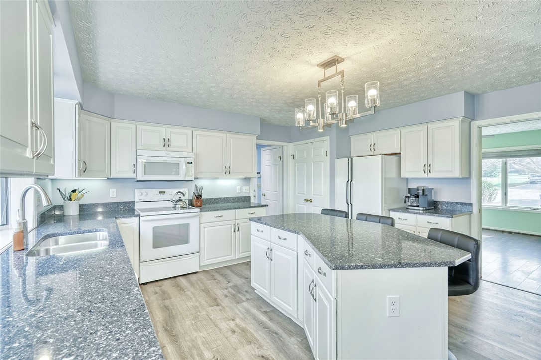 27 Edenfield Road Penfield, NY 14526 - Photo 10 of 48 updated eat-in kitchen with White cabinetry, grani