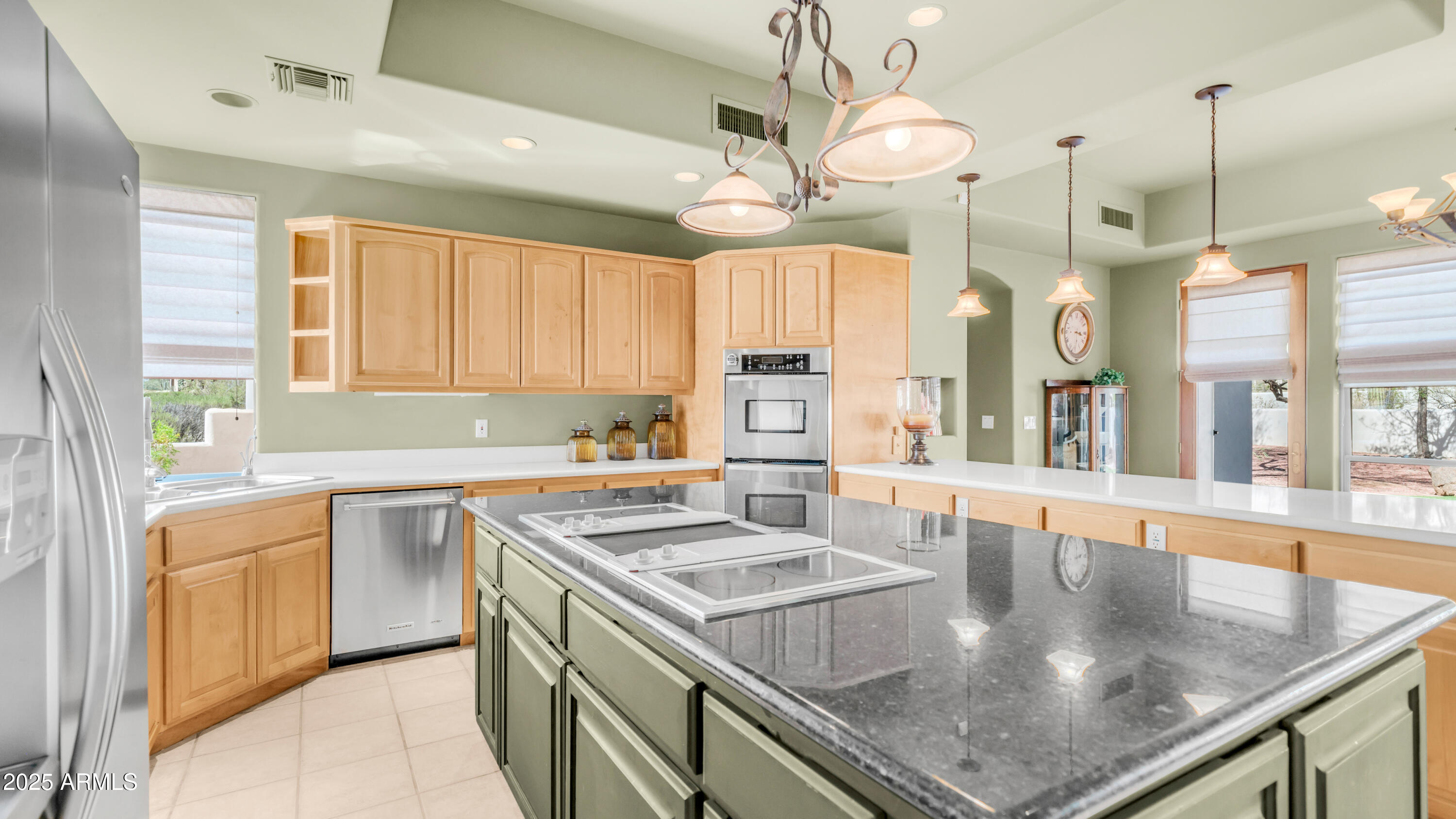 8540 East McDowell Road, Unit 116 Mesa, AZ 85207 - Photo 13 of 64 a kitchen with stainless steel appliances granite countertop a sink a stove and a table