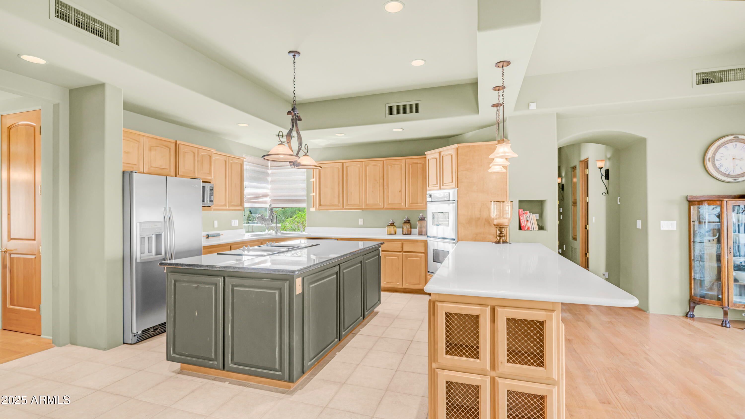 8540 East McDowell Road, Unit 116 Mesa, AZ 85207 - Photo 14 of 64 a kitchen with a stove and a refrigerator