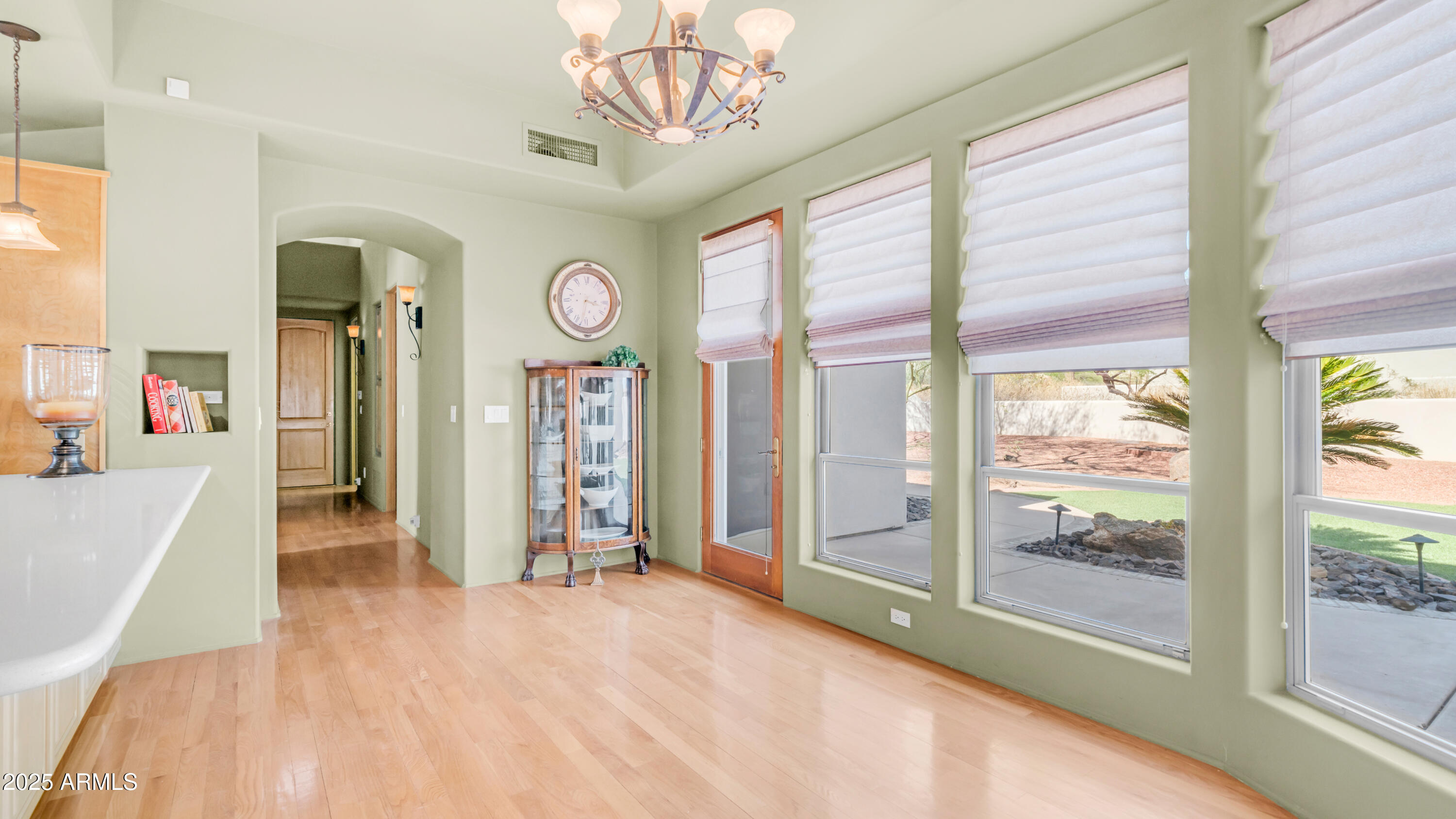 8540 East McDowell Road, Unit 116 Mesa, AZ 85207 - Photo 16 of 64 a view of a hallway with windows and chandelier