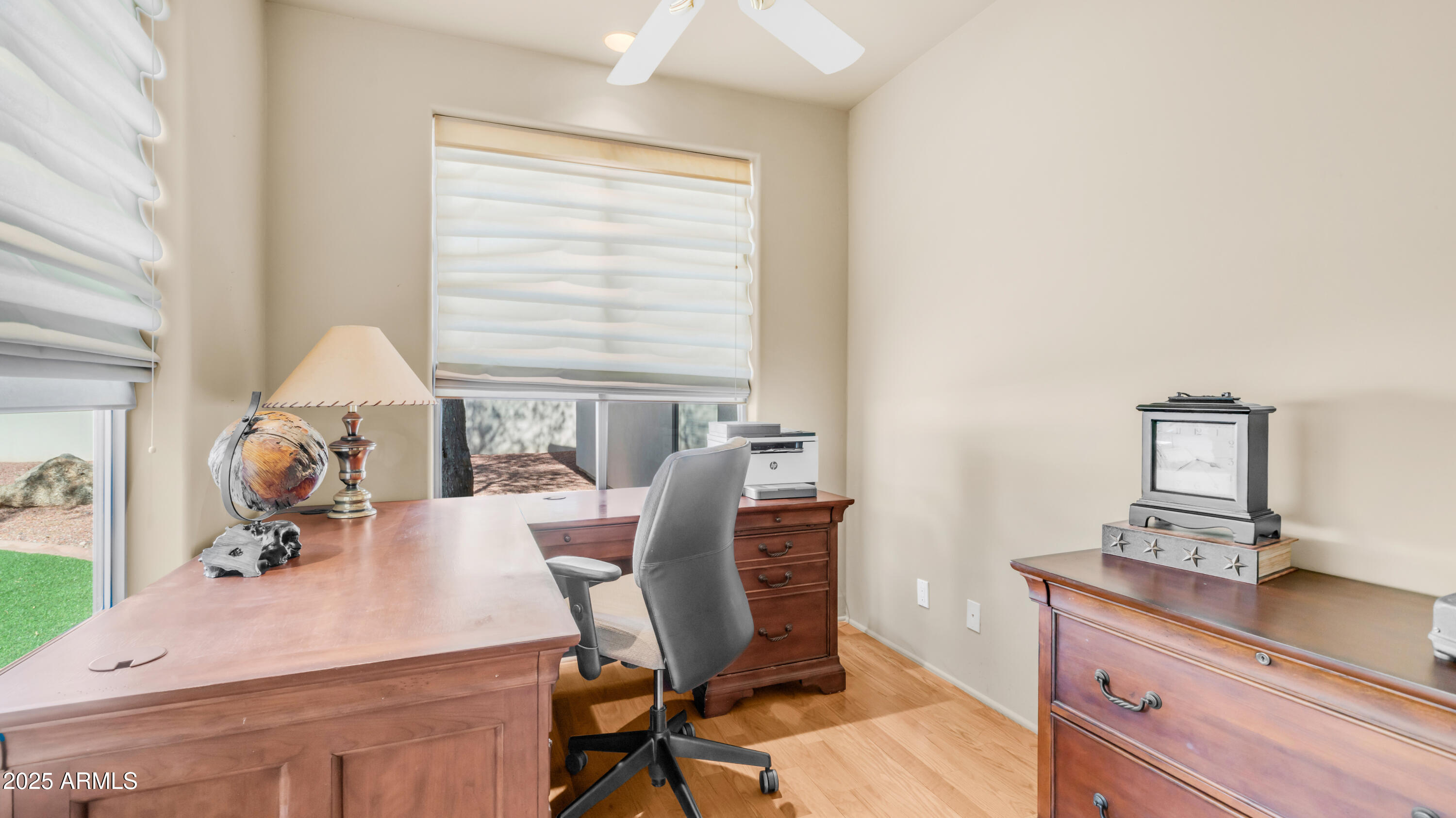 8540 East McDowell Road, Unit 116 Mesa, AZ 85207 - Photo 17 of 64 a view of a workspace with furniture and a window