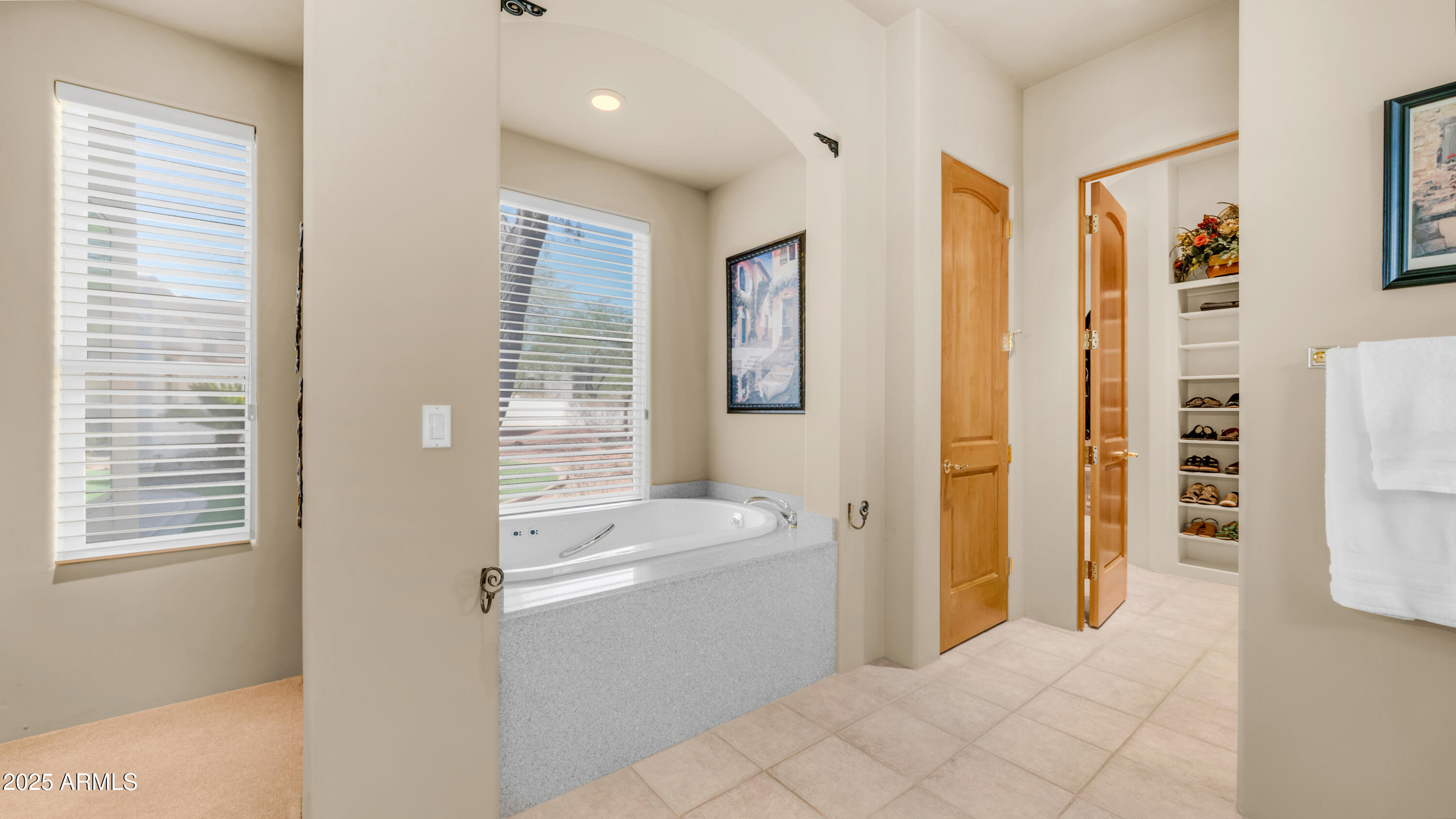8540 East McDowell Road, Unit 116 Mesa, AZ 85207 - Photo 21 of 64 a bathroom with a sink a mirror and a shower