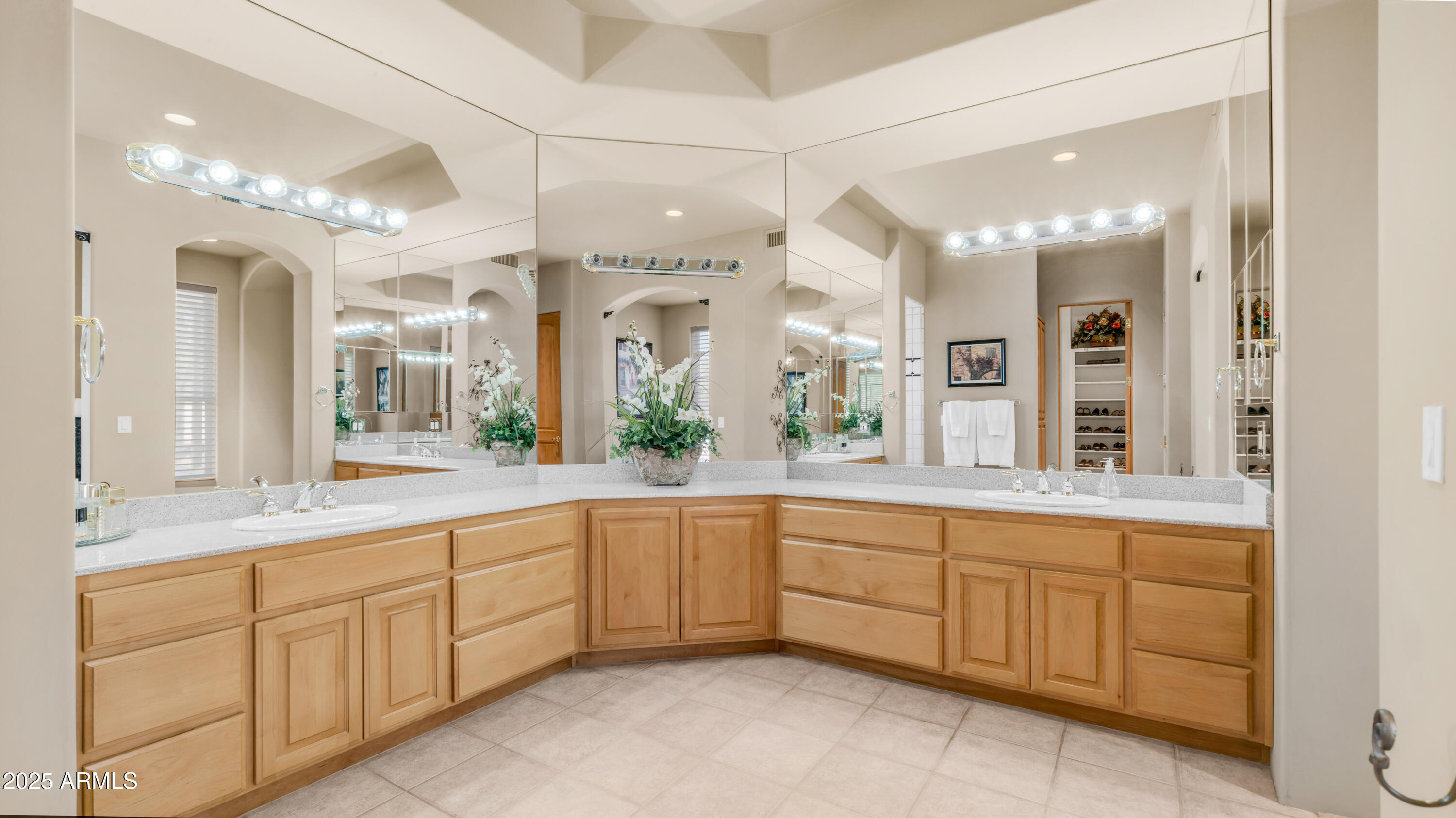 8540 East McDowell Road, Unit 116 Mesa, AZ 85207 - Photo 23 of 64 a large bathroom with a large mirror vanity and shower