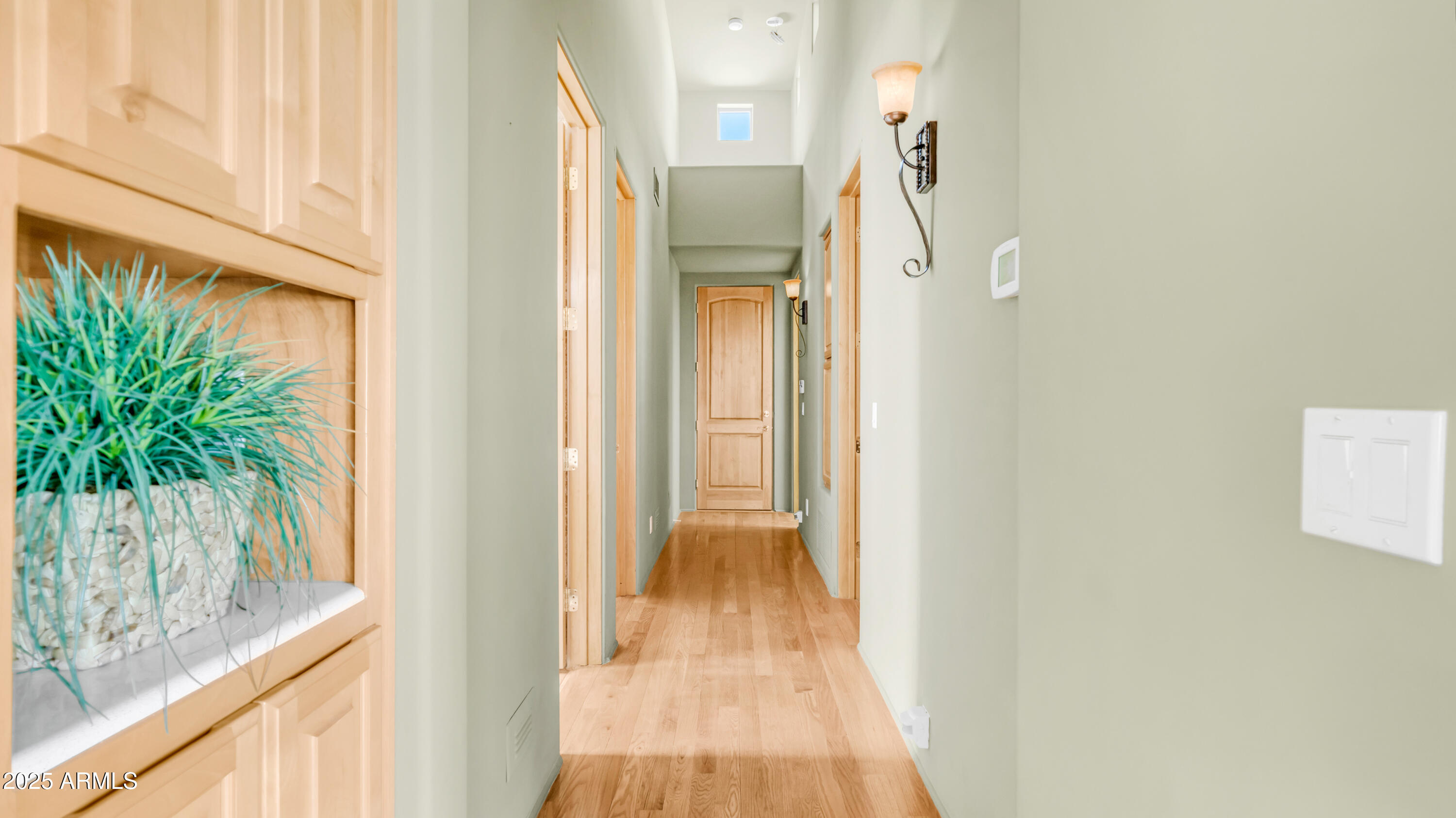 8540 East McDowell Road, Unit 116 Mesa, AZ 85207 - Photo 24 of 64 a view of a hallway with wooden floor and dining room