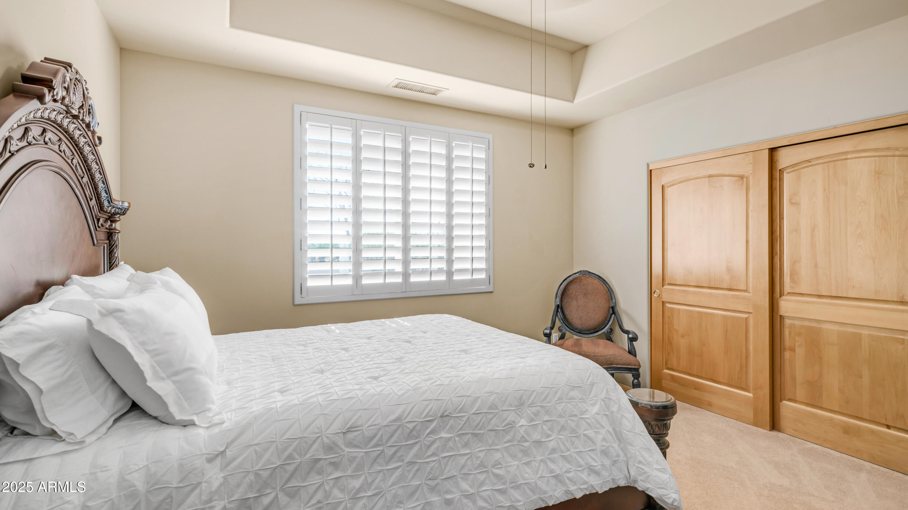8540 East McDowell Road, Unit 116 Mesa, AZ 85207 - Photo 25 of 64 a bedroom with a bed and a window