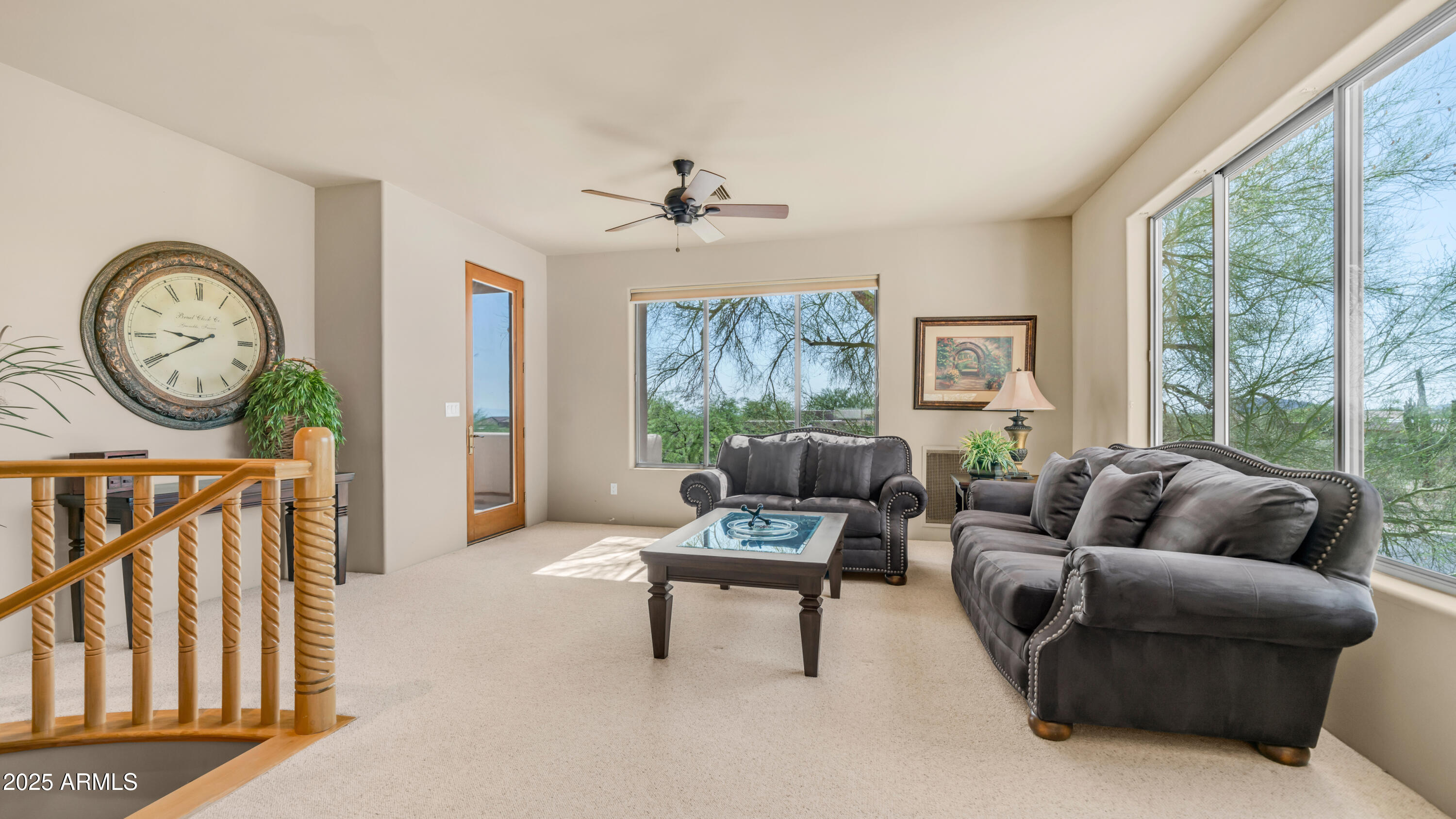 8540 East McDowell Road, Unit 116 Mesa, AZ 85207 - Photo 28 of 64 a living room with furniture a fireplace and a large window