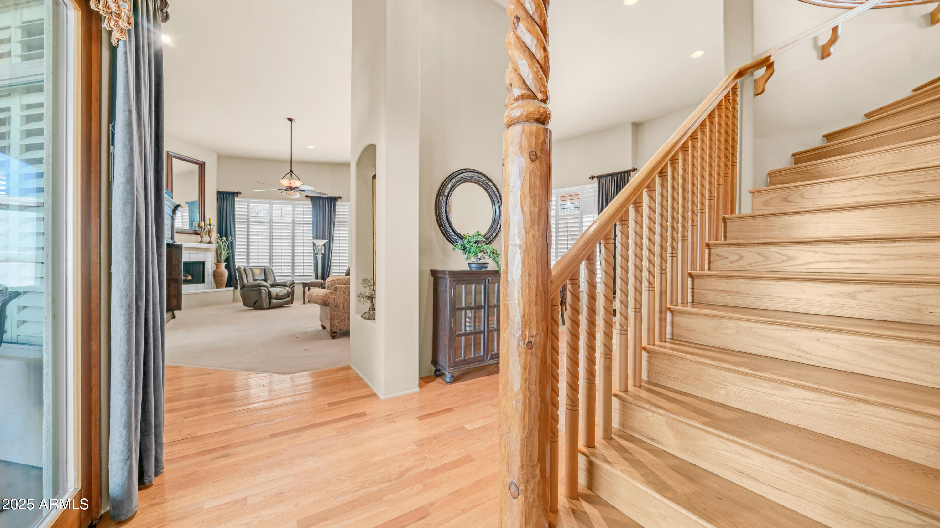 8540 East McDowell Road, Unit 116 Mesa, AZ 85207 - Photo 3 of 64 a view of entryway and hall with wooden floor