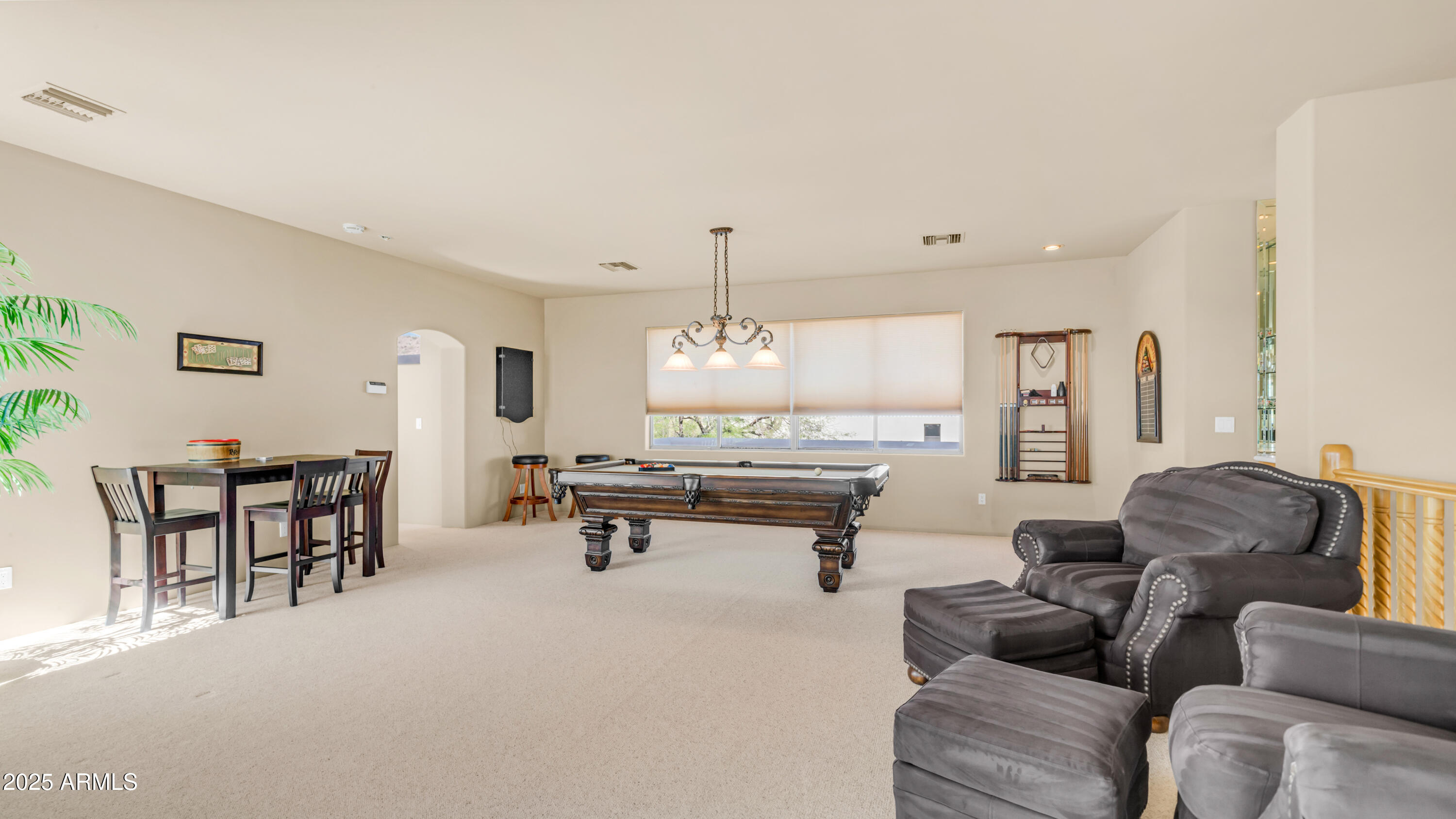 8540 East McDowell Road, Unit 116 Mesa, AZ 85207 - Photo 32 of 64 a living room with furniture a window and a table