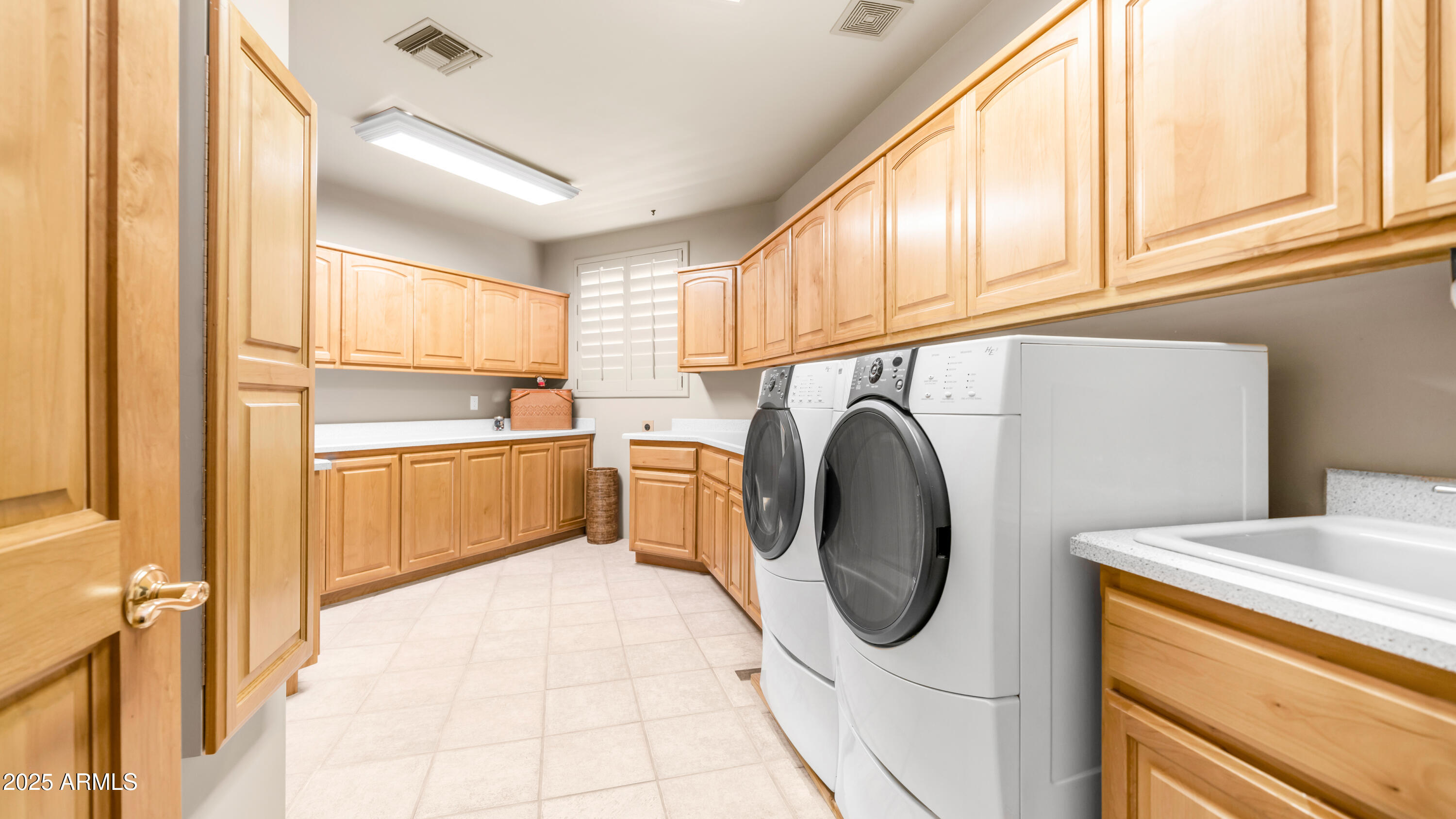 8540 East McDowell Road, Unit 116 Mesa, AZ 85207 - Photo 35 of 64 a utility room with dryer and washer
