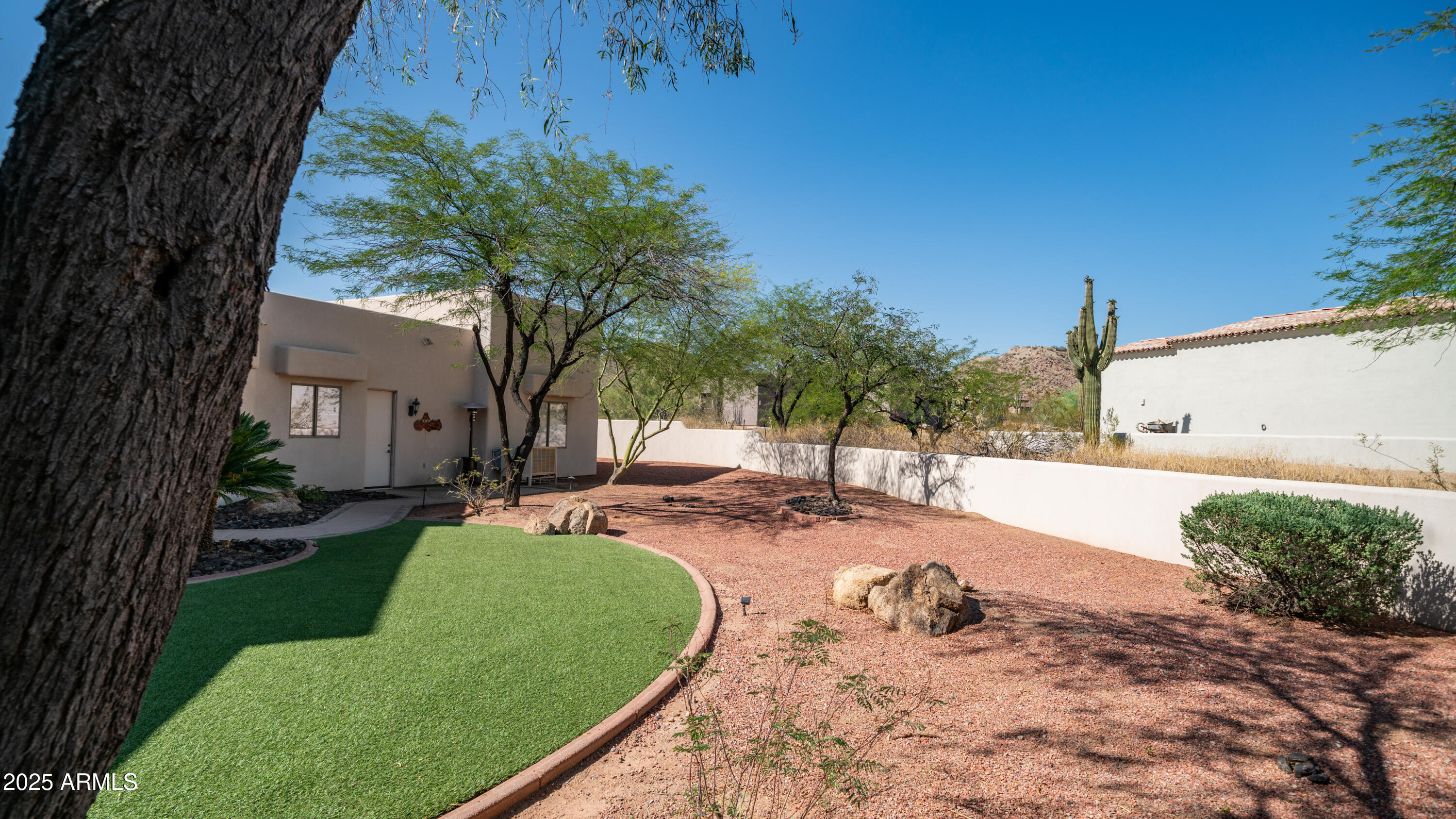 8540 East McDowell Road, Unit 116 Mesa, AZ 85207 - Photo 40 of 64 a view of a backyard with a garden and plants