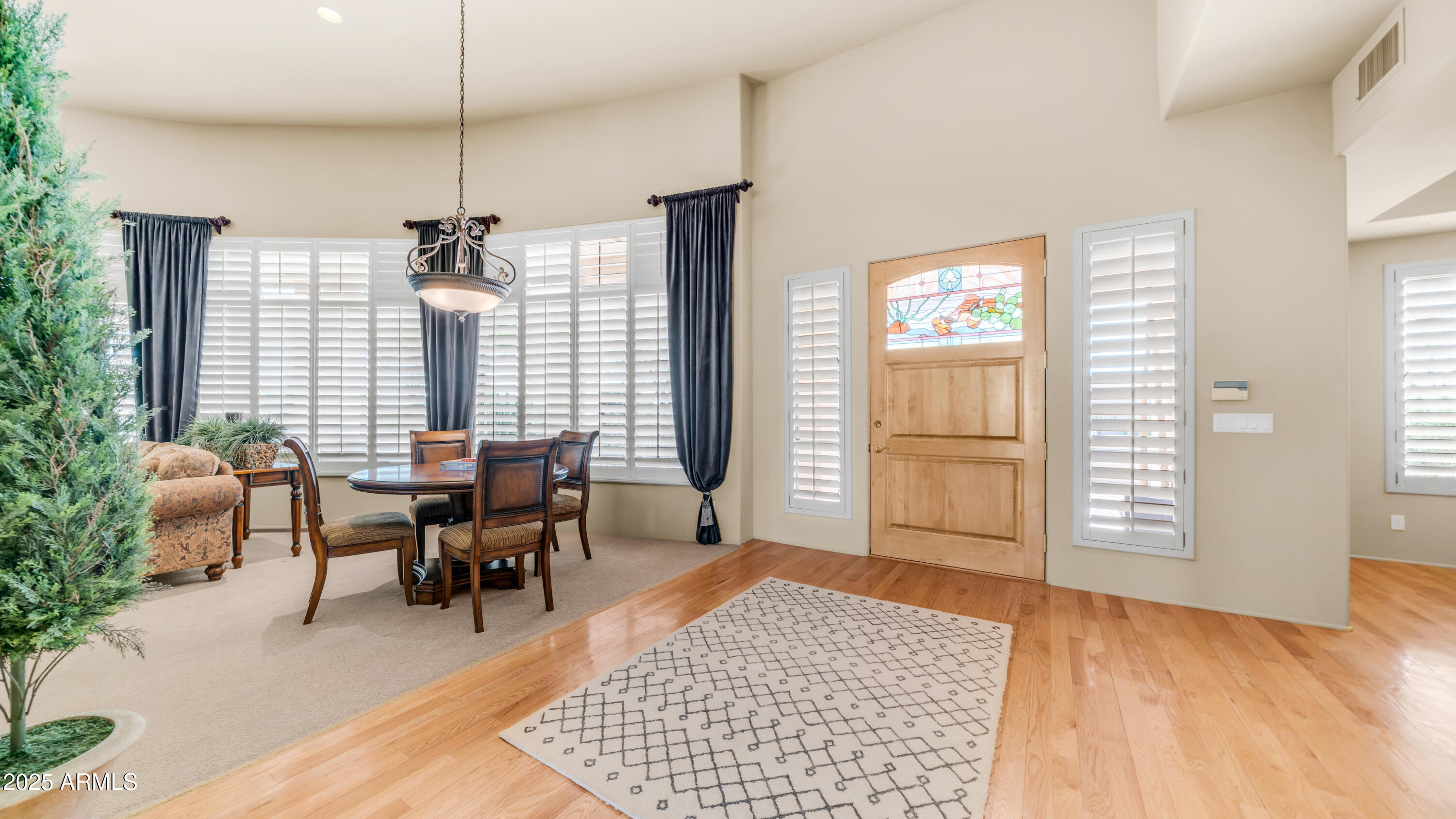 8540 East McDowell Road, Unit 116 Mesa, AZ 85207 - Photo 4 of 64 a view of a livingroom with furniture and window