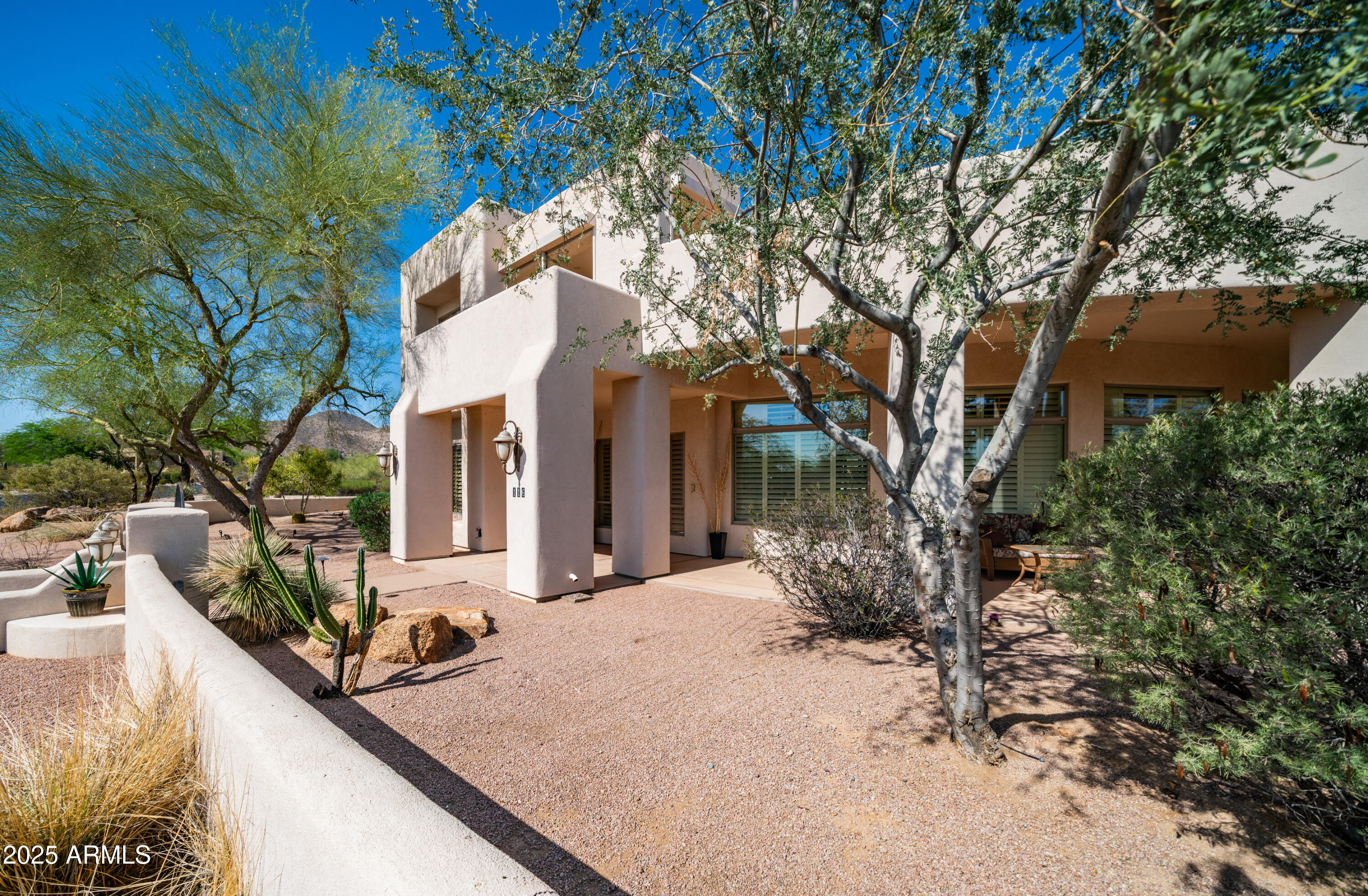 8540 East McDowell Road, Unit 116 Mesa, AZ 85207 - Photo 42 of 64 a view of a house with a snow in the yard