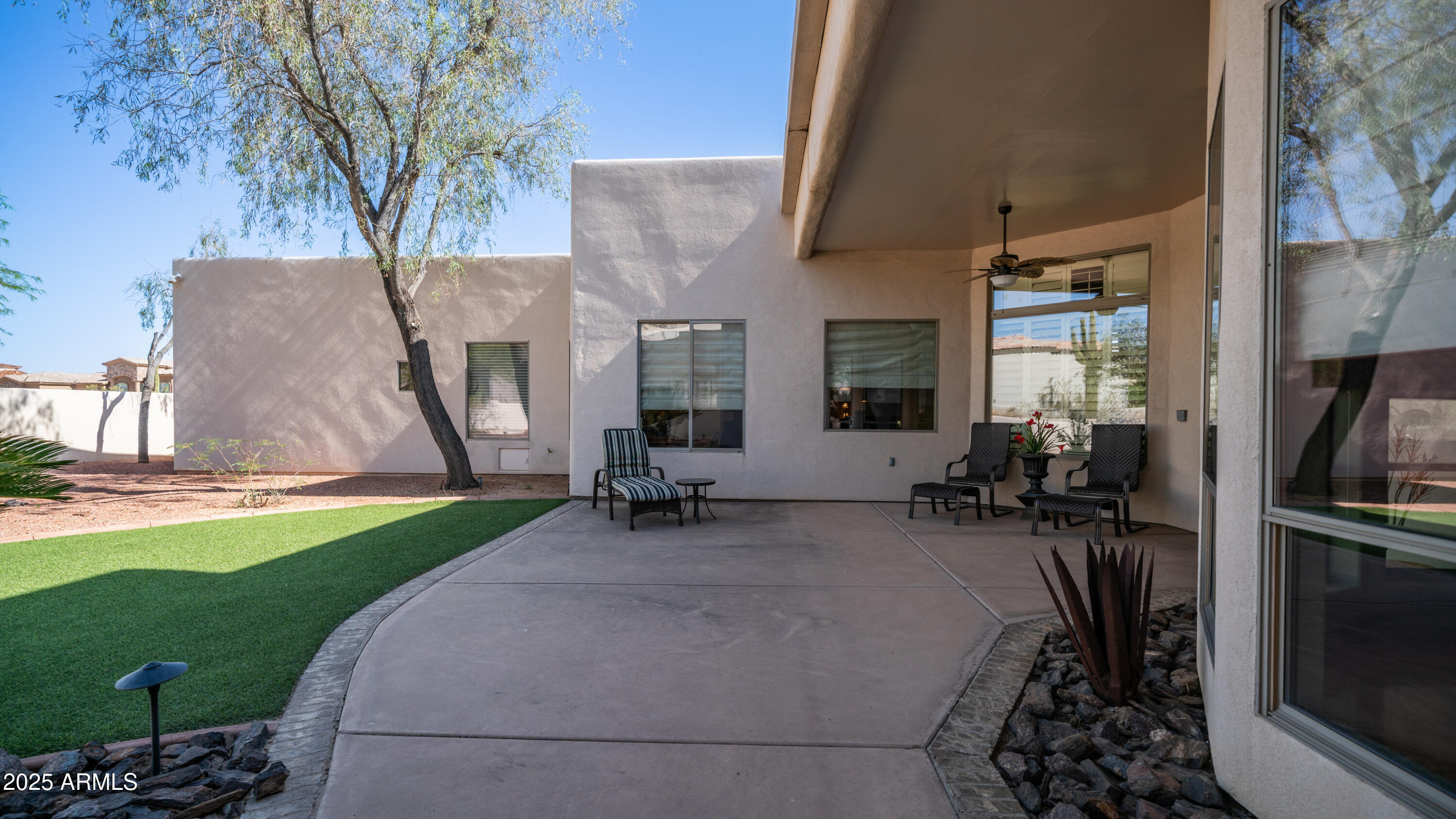 8540 East McDowell Road, Unit 116 Mesa, AZ 85207 - Photo 43 of 64 a view of a house with backyard and sitting area
