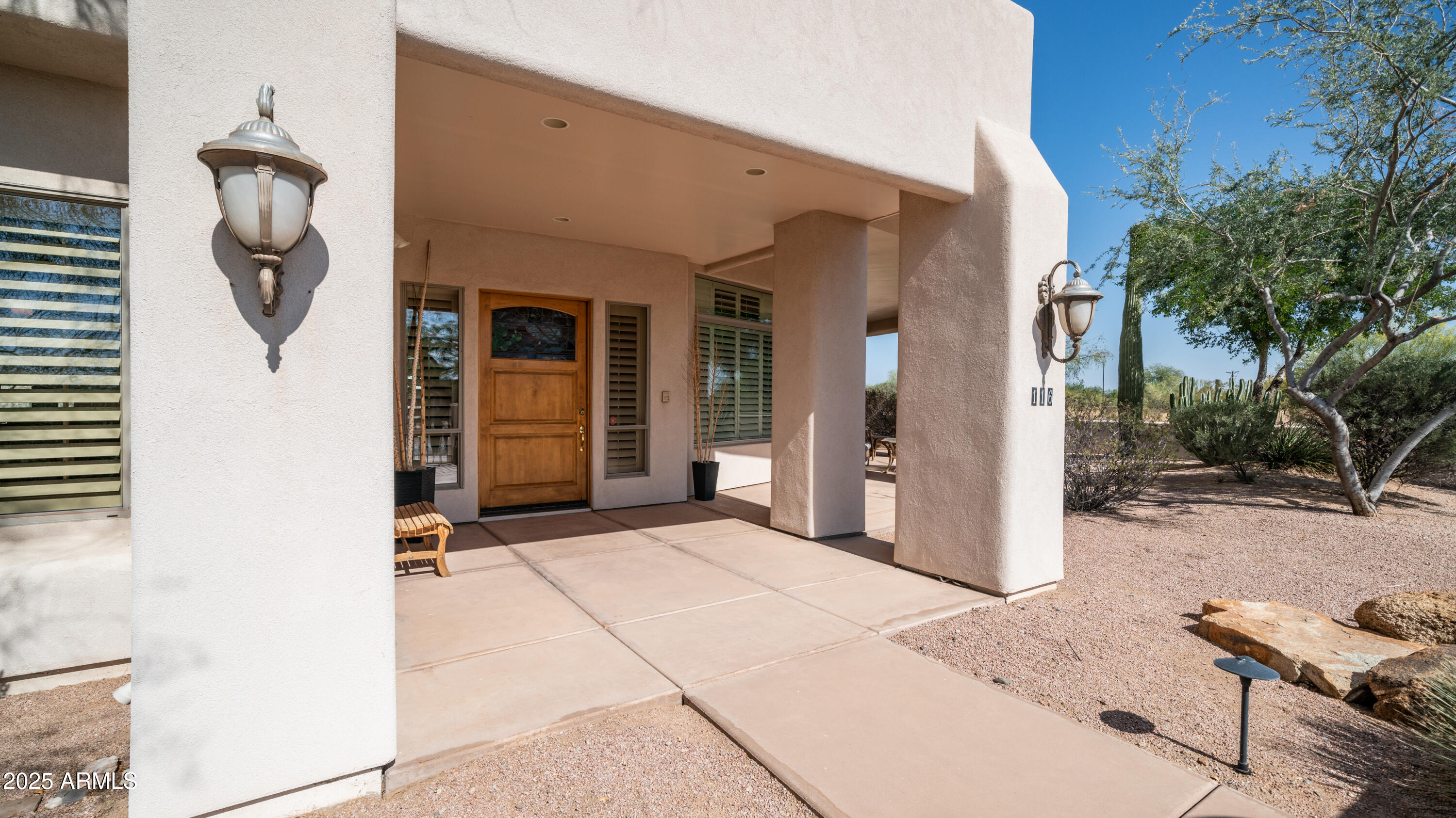 8540 East McDowell Road, Unit 116 Mesa, AZ 85207 - Photo 47 of 64 a view of a house with backyard and trees
