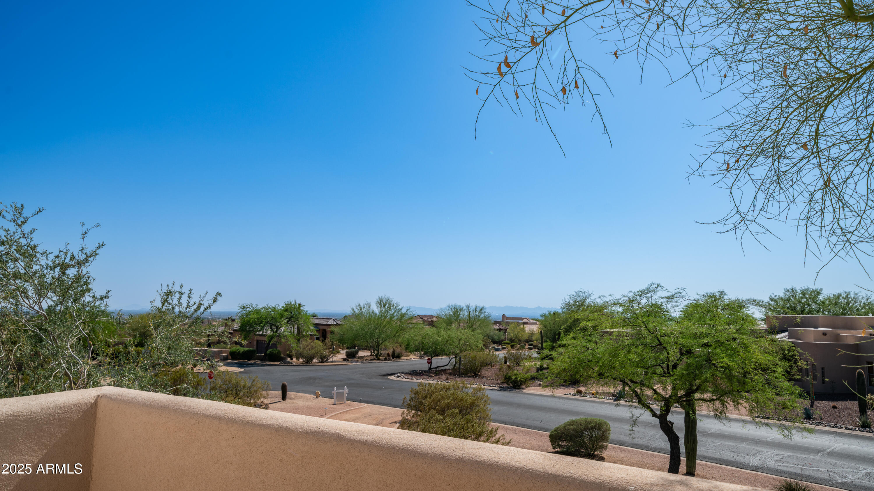 8540 East McDowell Road, Unit 116 Mesa, AZ 85207 - Photo 54 of 64 a view of a street with a building in the background