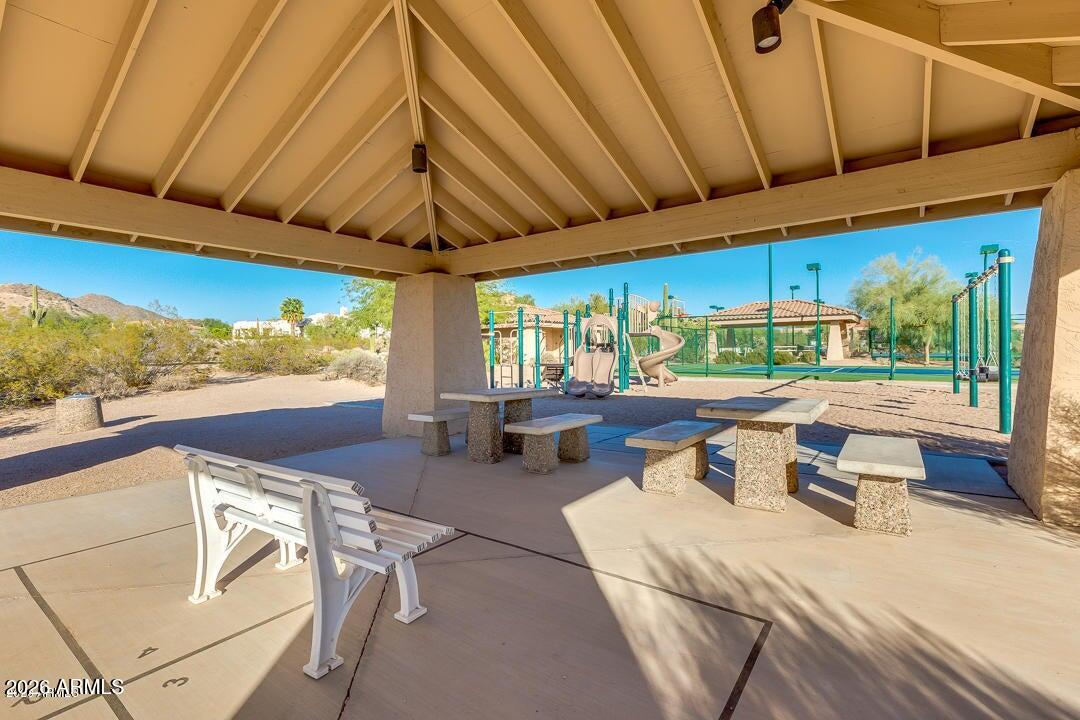 8540 East McDowell Road, Unit 116 Mesa, AZ 85207 - Photo 58 of 64 a outdoor space with the couches and dining table with the view of swimming pool
