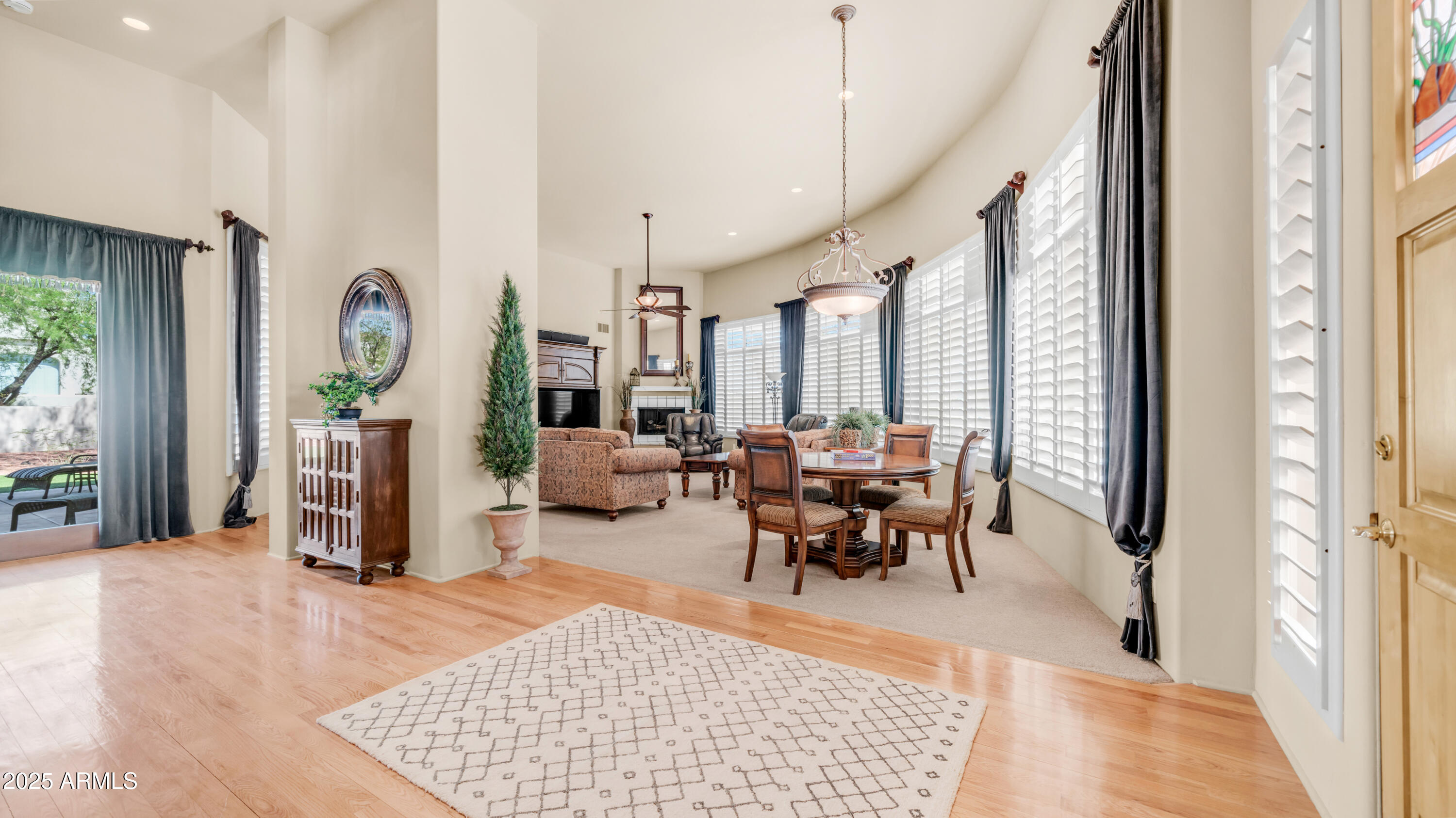 8540 East McDowell Road, Unit 116 Mesa, AZ 85207 - Photo 6 of 64 a view of a livingroom with furniture window and wooden floor