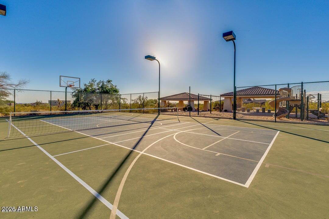 8540 East McDowell Road, Unit 116 Mesa, AZ 85207 - Photo 63 of 64 a view of a tennis court with lamp on a street