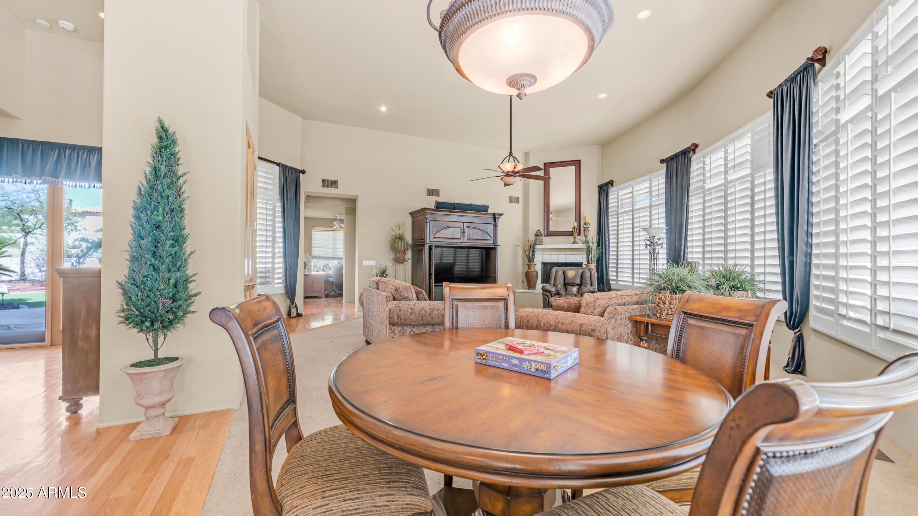 8540 East McDowell Road, Unit 116 Mesa, AZ 85207 - Photo 7 of 64 a dining room with furniture a livingroom and chandelier