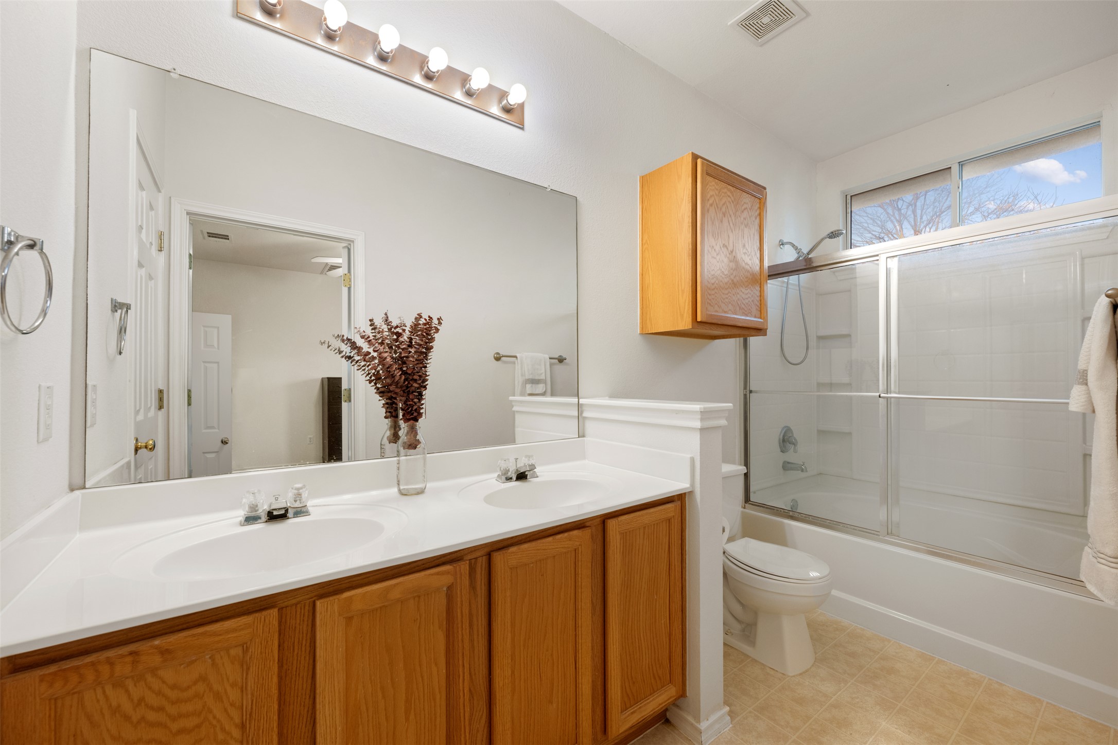 804 Estancia Way Leander, TX 78641 - Photo 11 of 40 a bathroom with a sink a toilet and shower