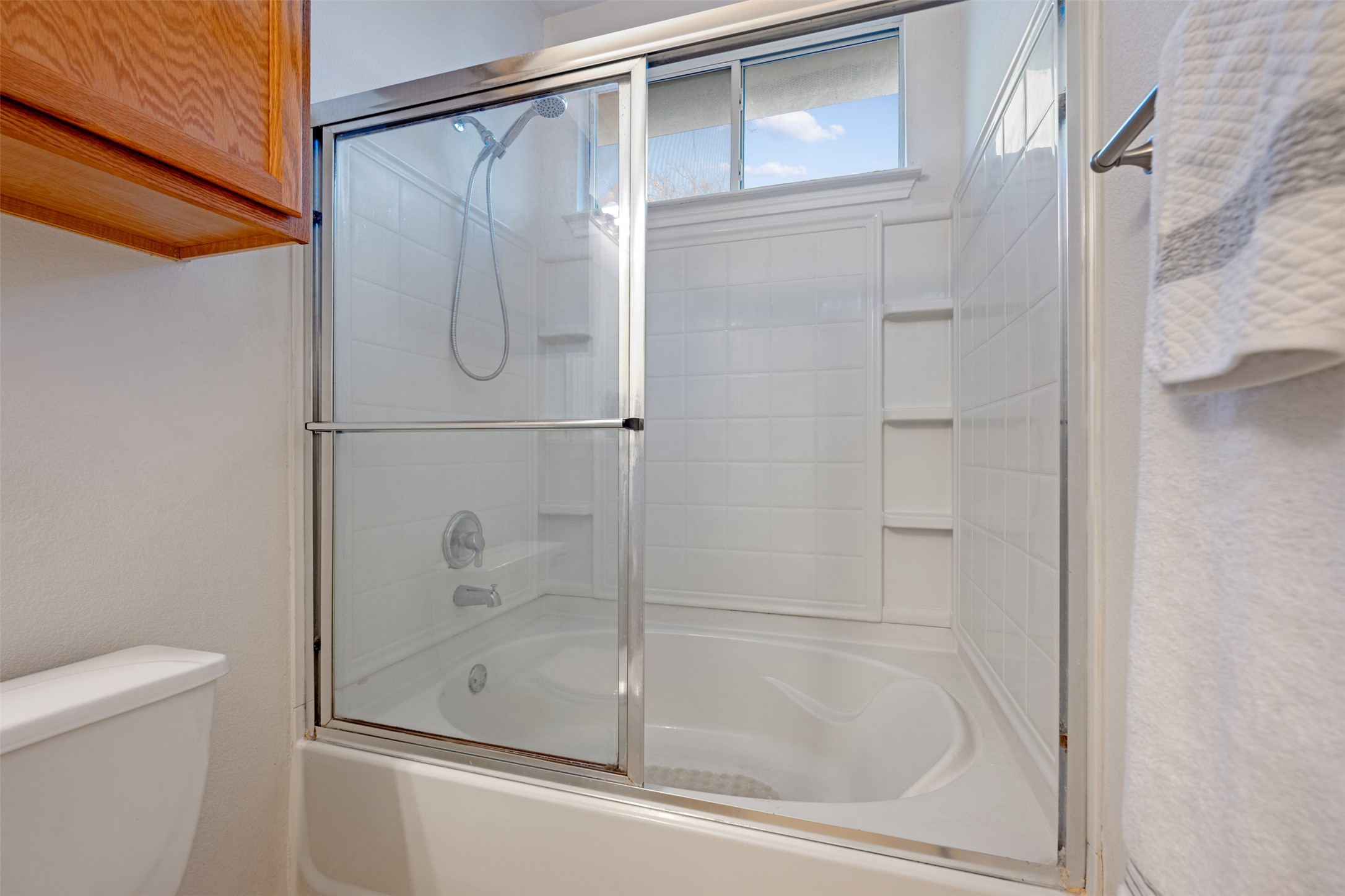 804 Estancia Way Leander, TX 78641 - Photo 12 of 40 a bathroom with a glass shower door