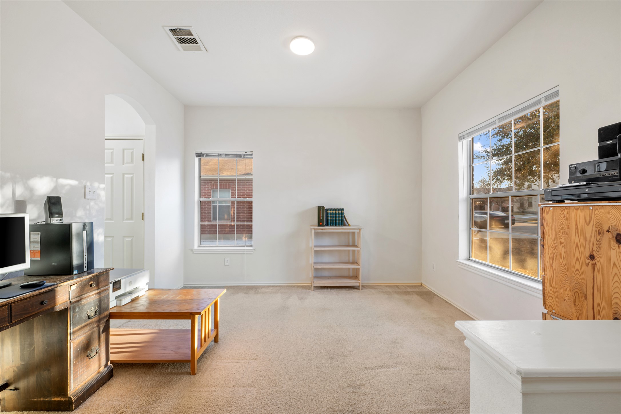804 Estancia Way Leander, TX 78641 - Photo 4 of 40 a living room with furniture and a flat screen tv