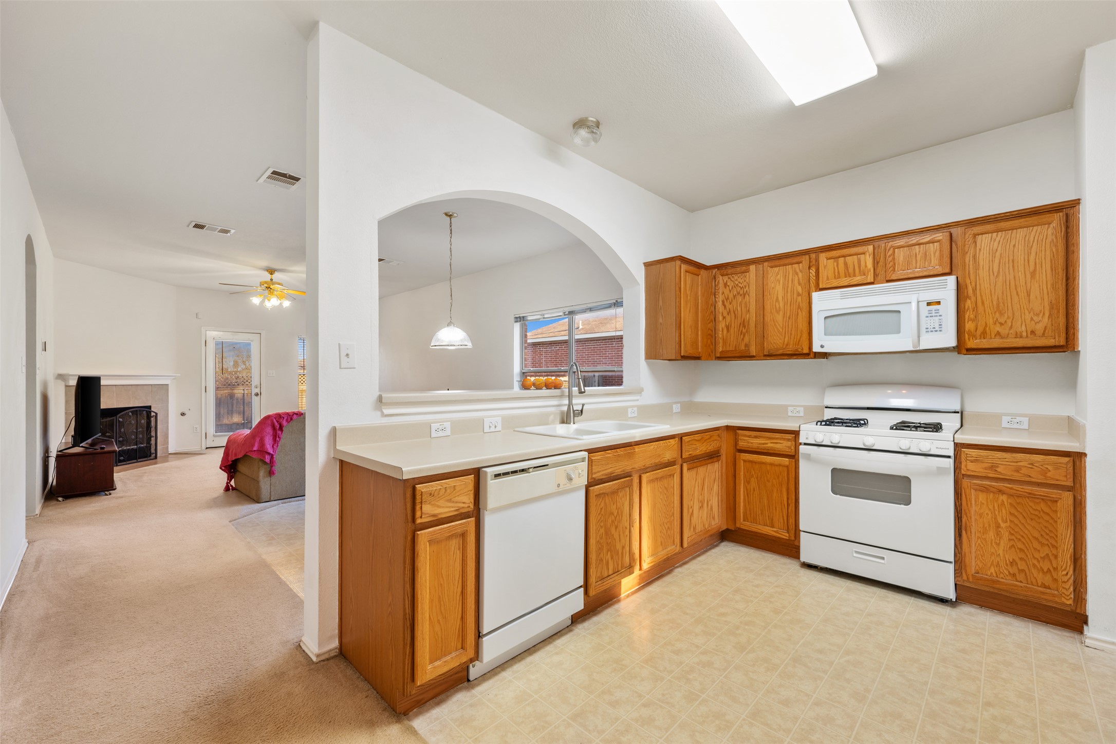 804 Estancia Way Leander, TX 78641 - Photo 39 of 40 a kitchen with stainless steel appliances granite countertop a stove and a sink