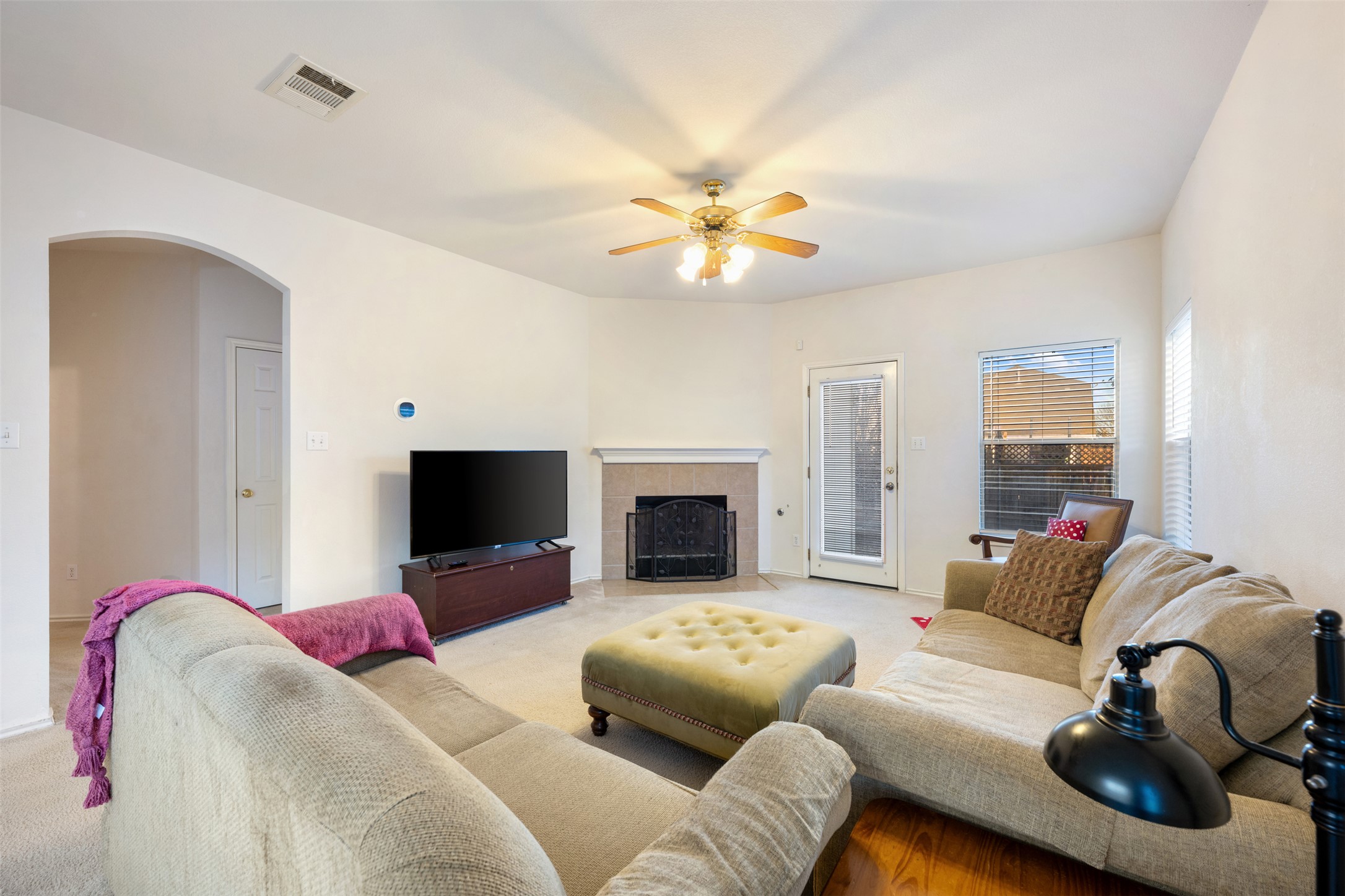 804 Estancia Way Leander, TX 78641 - Photo 9 of 40 a living room with furniture flat screen tv and a fireplace