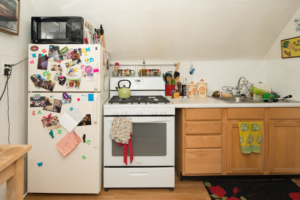 2015 West Iowa Street, Unit 2 Chicago, IL 60622 - Photo 3 of 20 a white kitchen with a refrigerator and a stove