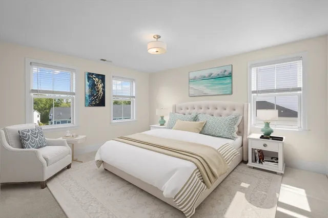 a bedroom with a bed and a couch