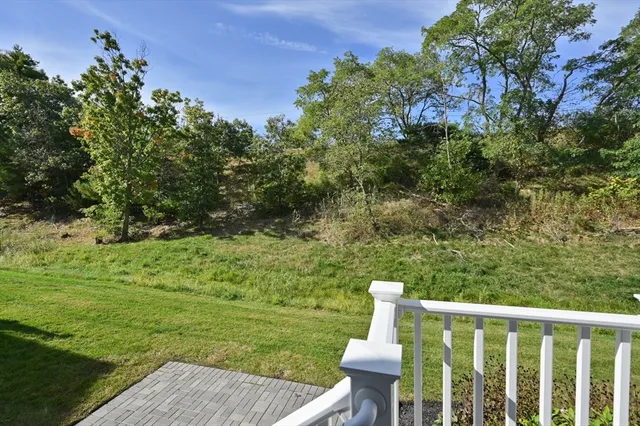 a view of a two chairs next to a yard