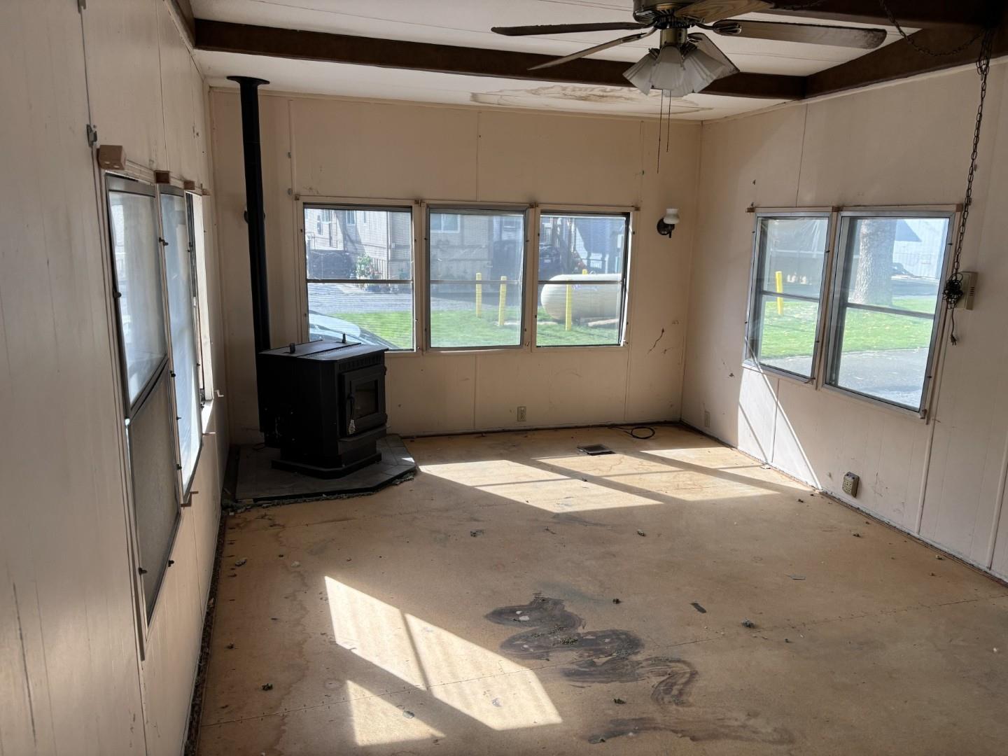 2933 Forebay Road, Unit 32 Pollock Pines, CA 95726 - Photo 6 of 15 a view of empty room with a fireplace and windows