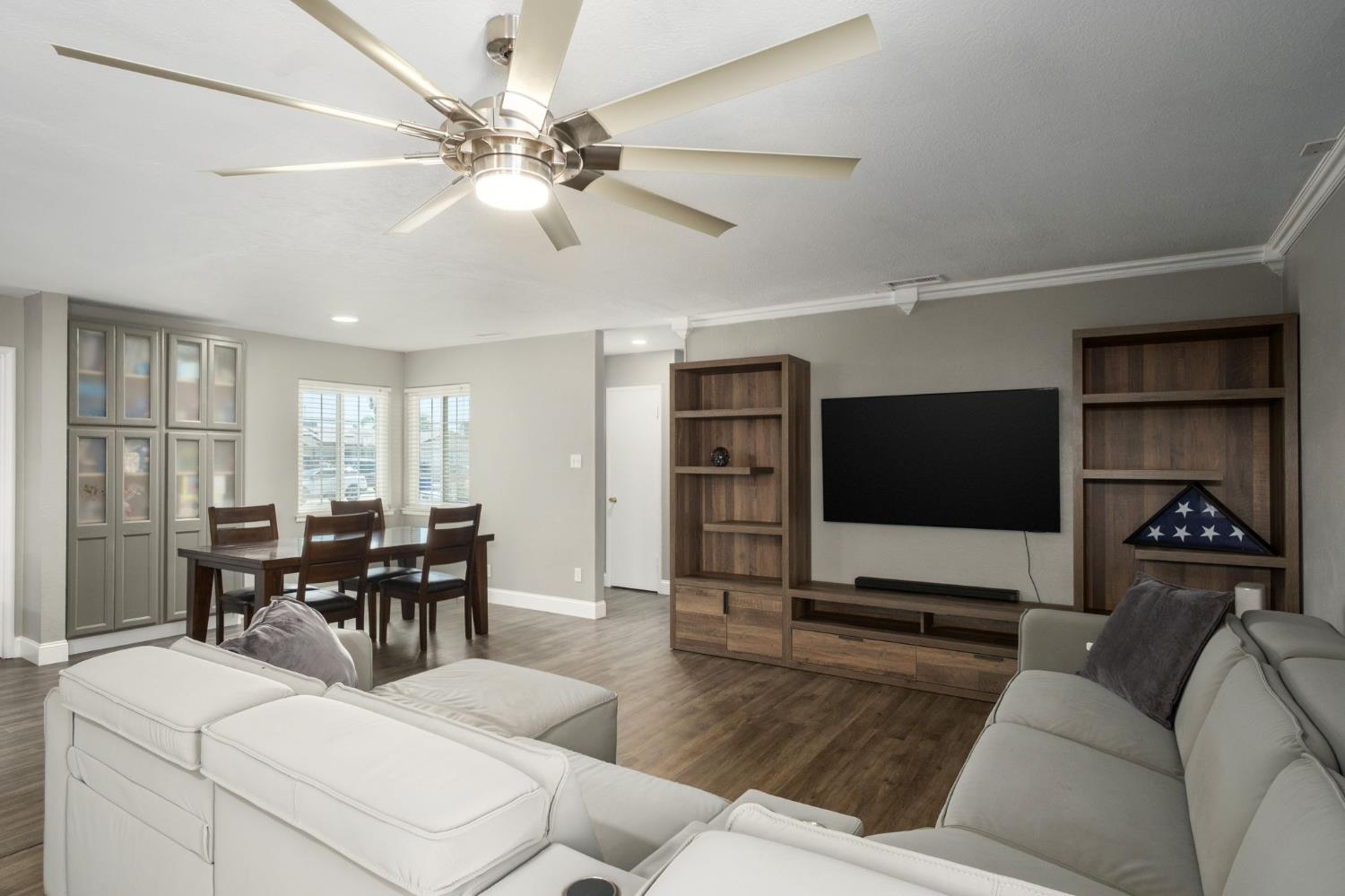 2604 Harvard Avenue Clovis, CA 93612 - Photo 11 of 28 a living room with furniture and a flat screen tv