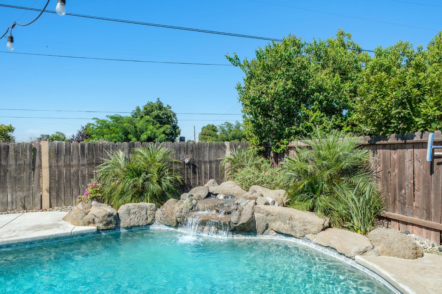 2604 Harvard Avenue Clovis, CA 93612 - Photo 25 of 28 a garden with trees in front of it
