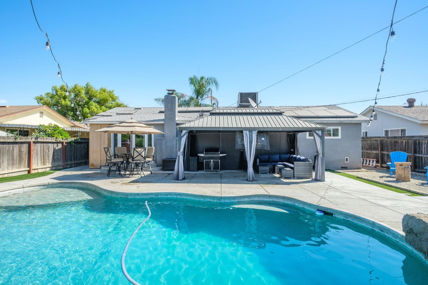 2604 Harvard Avenue Clovis, CA 93612 - Photo 27 of 28 a view of a house with swimming pool