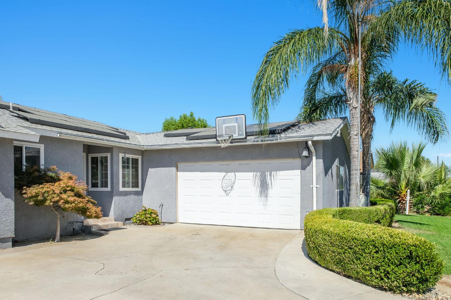 2604 Harvard Avenue Clovis, CA 93612 - Photo 3 of 28 a front view of a house with garden